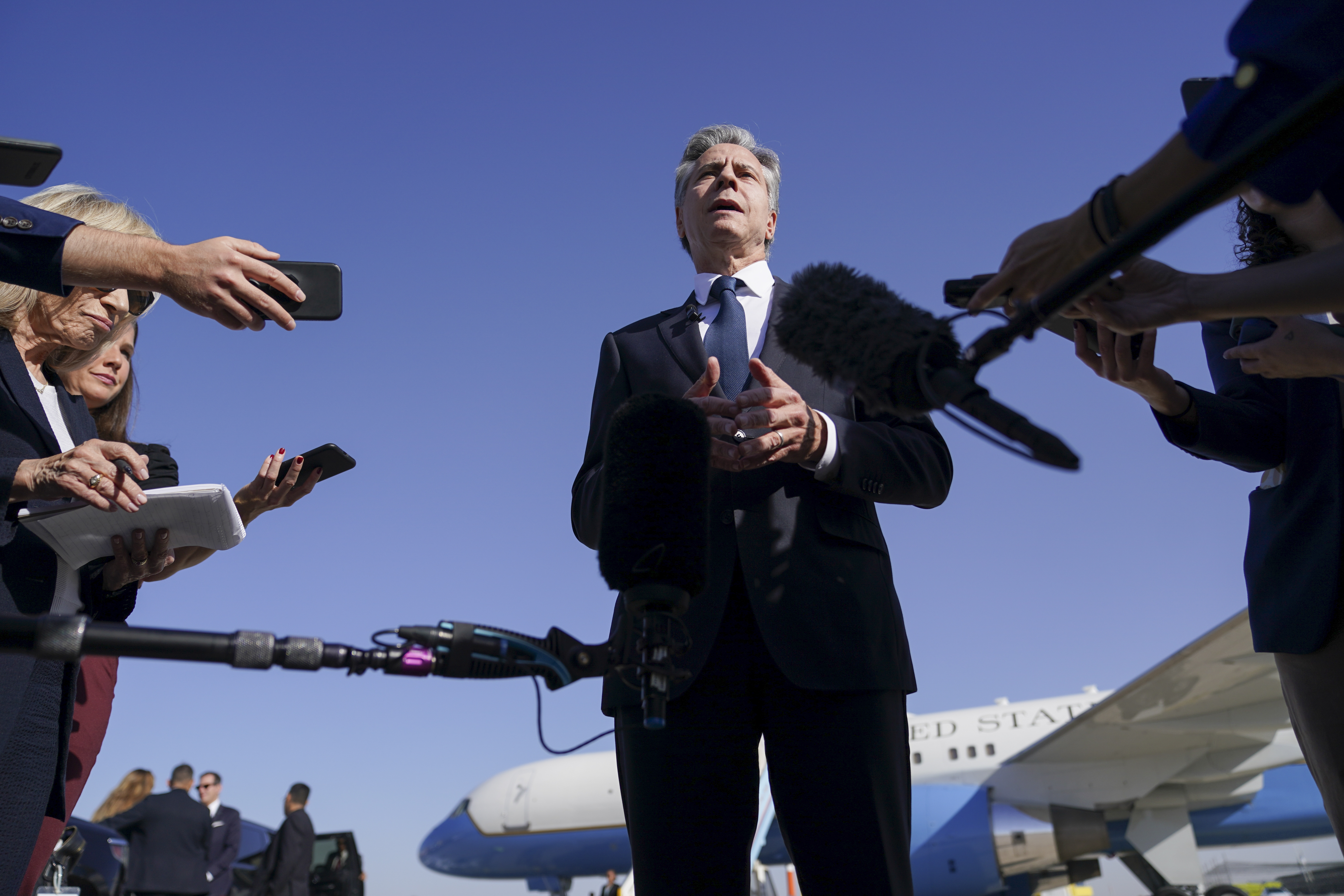 U.S. Secretary of State Antony Blinken speaks with members of the media as he arrives at Ben Gurion International Airport before departing for Riyadh, Saudi Arabia, in Tel Aviv, Israel, Wednesday, Oct. 23, 2024. (Nathan Howard/Pool Photo via AP)