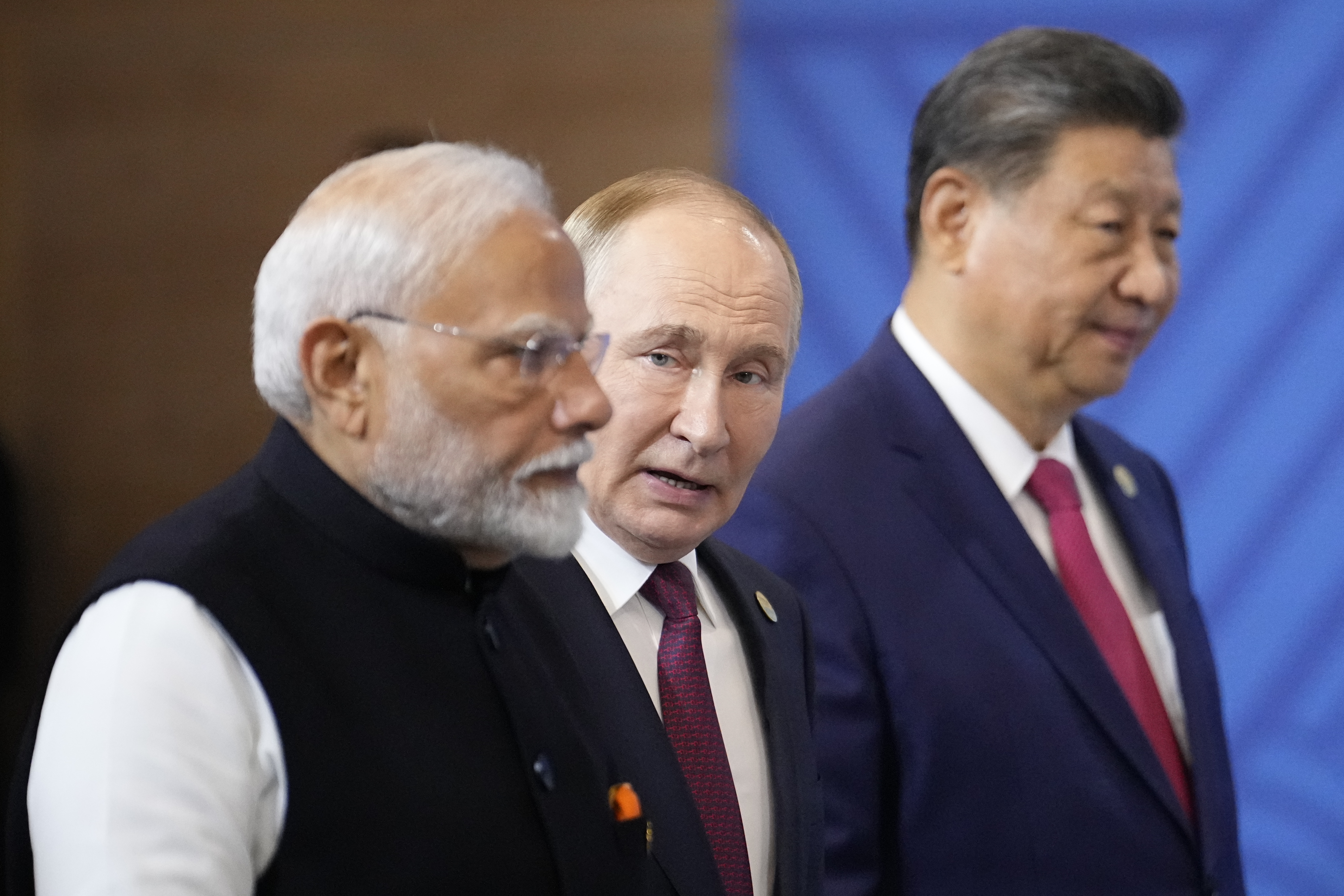 From left, Indian Prime Minister Narendra Modi, Russian President Vladimir Putin and Chinese President Xi Jinping attend a family photo ceremony prior to the BRICS Summit plenary session in Kazan, Russia, Wednesday, Oct. 23, 2024. (AP Photo/Alexander Zemlianichenko, Pool)