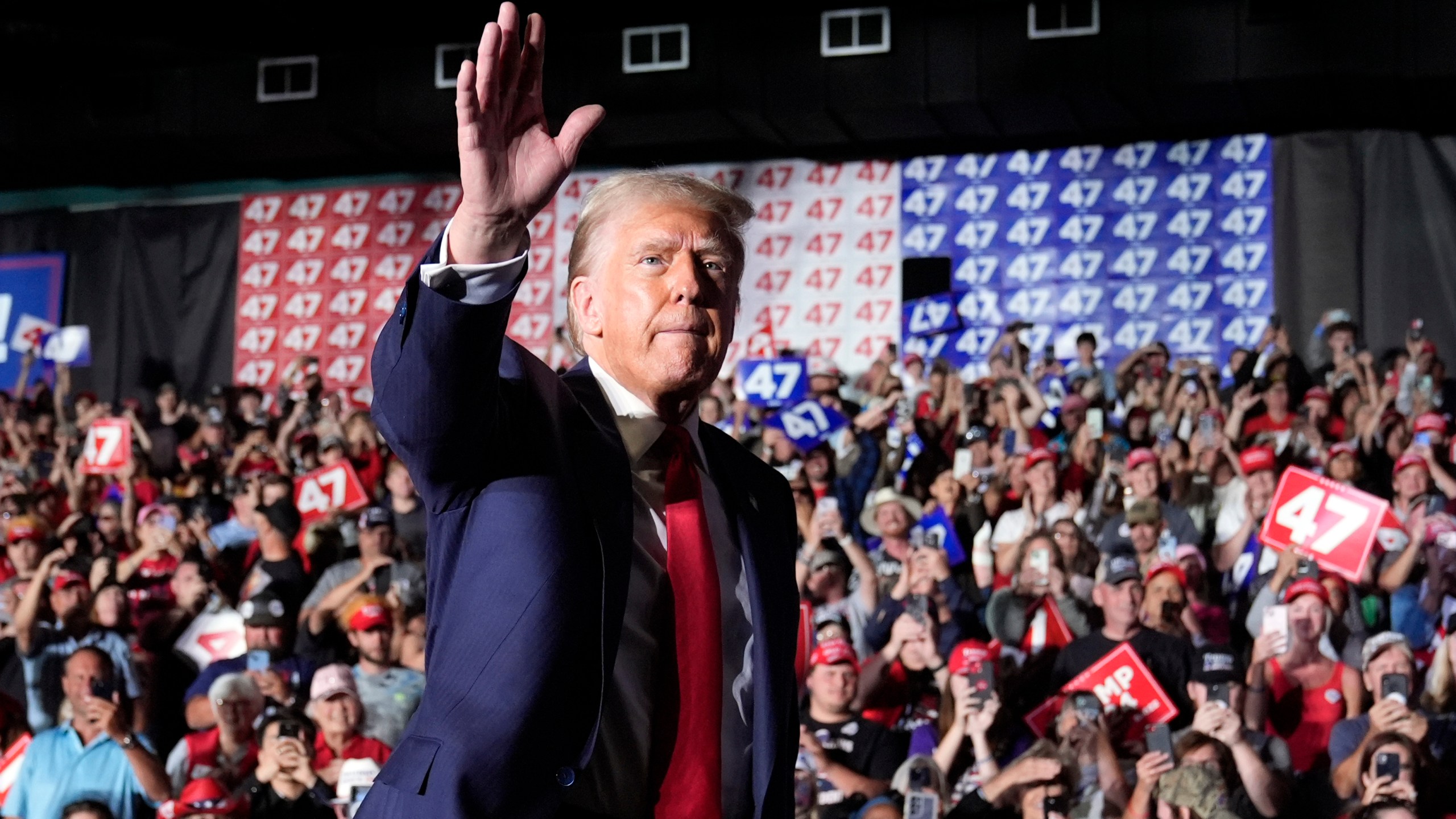 Republican presidential nominee former President Donald Trump waves at a campaign rally at Greensboro Coliseum, Tuesday, Oct. 22, 2024, in Greensboro, N.C. (AP Photo/Alex Brandon)