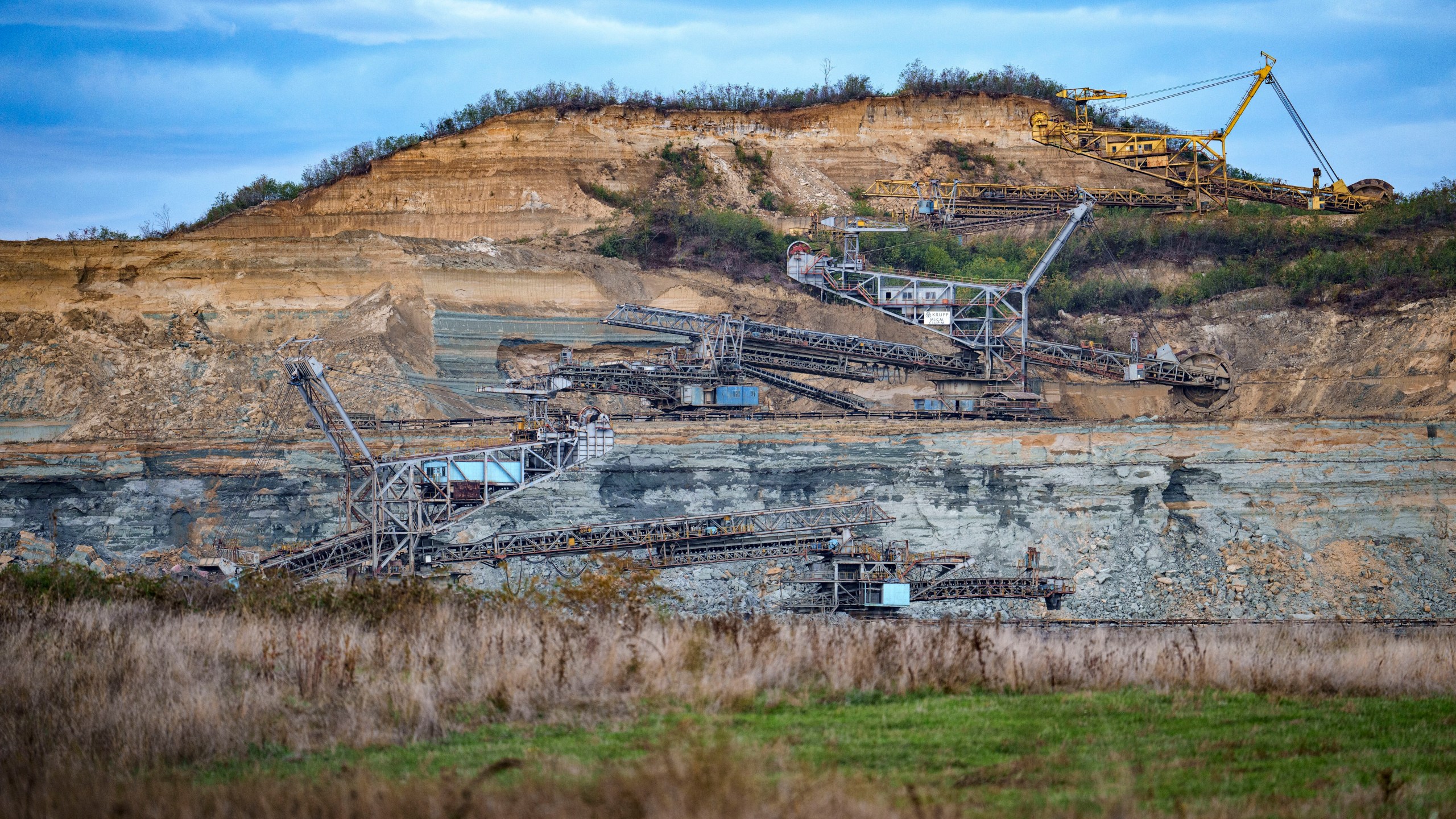 Coal extraction equipment operates at the open air quarry outside Matasari, southern Romania, Friday, Oct. 11, 2024. (AP Photo/Vadim Ghirda)