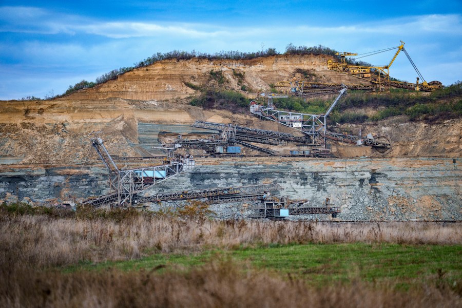 Coal extraction equipment operates at the open air quarry outside Matasari, southern Romania, Friday, Oct. 11, 2024. (AP Photo/Vadim Ghirda)