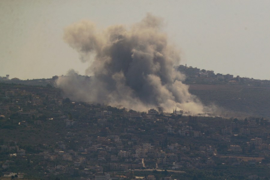 Smoke rises from an Israeli airstrike on Mansouri village, as it seen from the southern city of Tyre, south Lebanon, Thursday, Oct. 24, 2024. (AP Photo/Mohammed Zaatari)