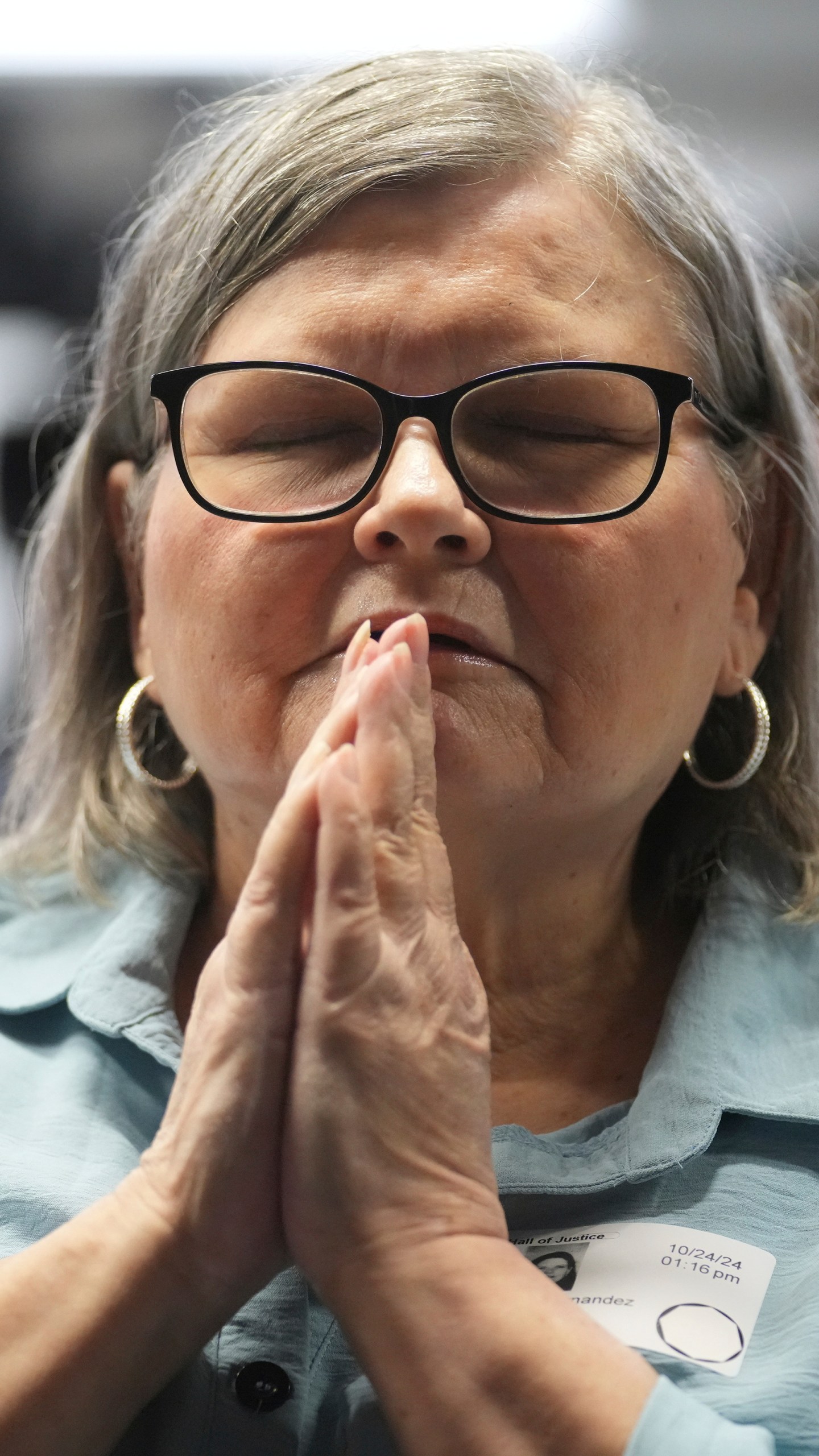 Diane Hernandez niece of Kitty Menendez sits prior to a news conference being held by Los Angeles County District Attorney George Gascon at the Hall of Justice on Thursday, Oct. 24, 2024, in Los Angeles. (AP Photo/Eric Thayer)