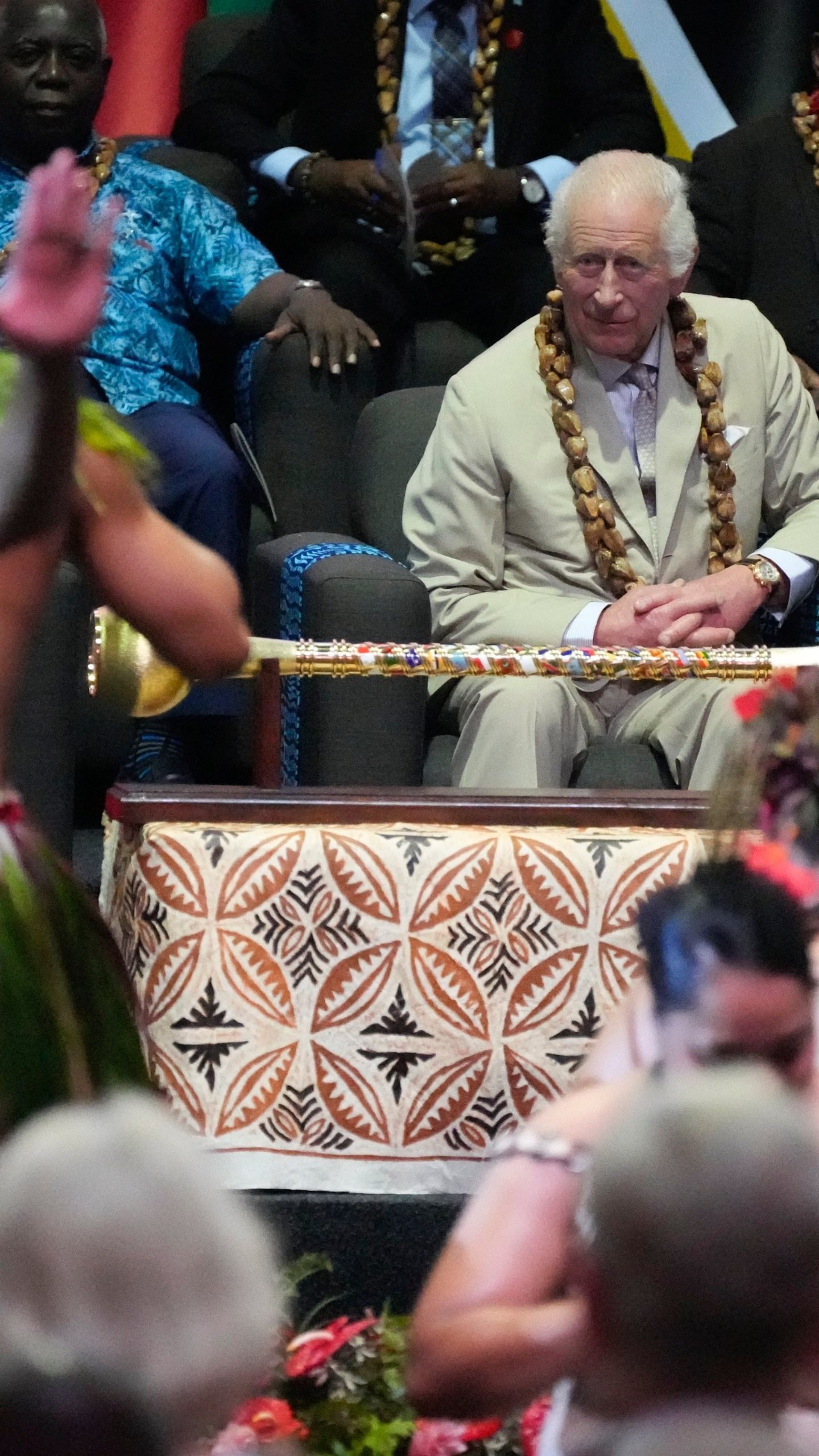 Britain's King Charles watches dancers perform during the opening ceremony for the Commonwealth Heads of Government meeting in Apia, Samoa, Friday, Oct. 25, 2024. (AP Photo/Rick Rycroft/Pool)