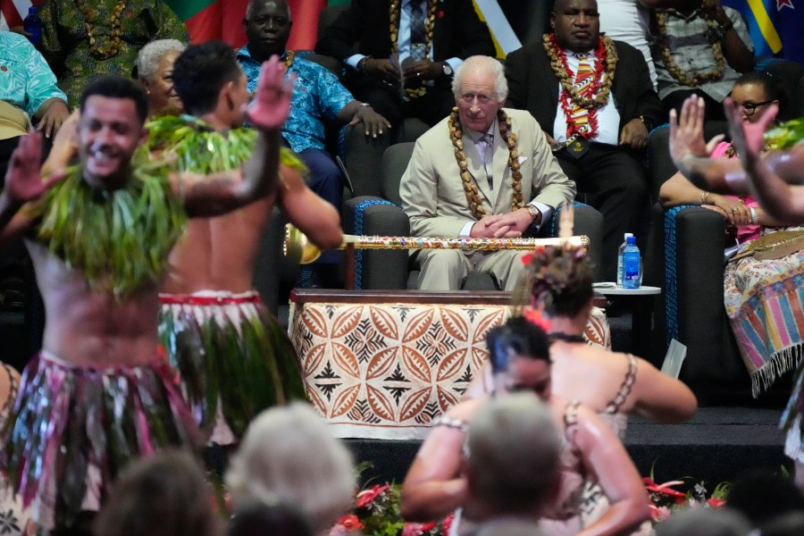 Britain's King Charles watches dancers perform during the opening ceremony for the Commonwealth Heads of Government meeting in Apia, Samoa, Friday, Oct. 25, 2024. (AP Photo/Rick Rycroft/Pool)