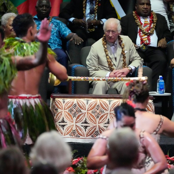 Britain's King Charles watches dancers perform during the opening ceremony for the Commonwealth Heads of Government meeting in Apia, Samoa, Friday, Oct. 25, 2024. (AP Photo/Rick Rycroft/Pool)