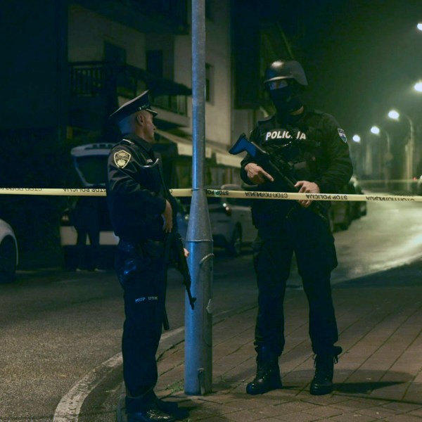 Bosnian police officer guard the local police station after a teenager broke and killed one officer with a knife and wounded another, in the town of Bosanska Krupa, 200 kilometers (120 miles) northwest of Bosnia's capital Sarajevo, Thursday, Oct. 24, 2024. (AP Photo/Edvin Zulic)