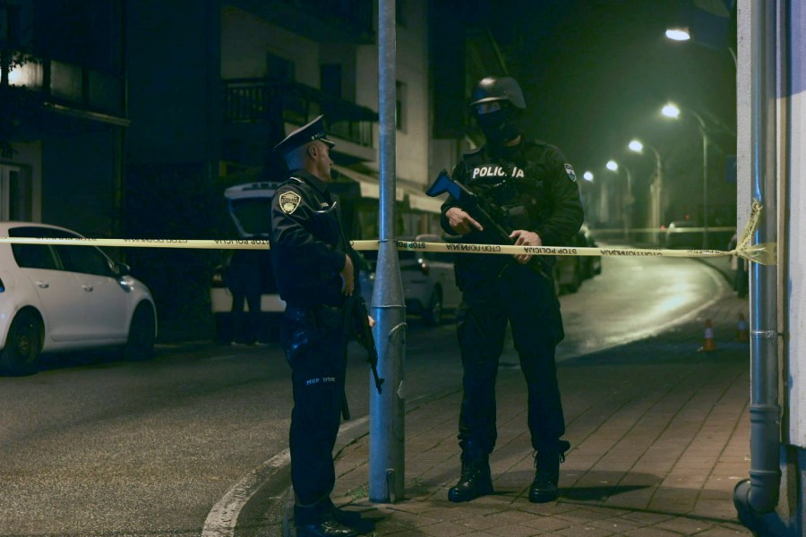 Bosnian police officer guard the local police station after a teenager broke and killed one officer with a knife and wounded another, in the town of Bosanska Krupa, 200 kilometers (120 miles) northwest of Bosnia's capital Sarajevo, Thursday, Oct. 24, 2024. (AP Photo/Edvin Zulic)