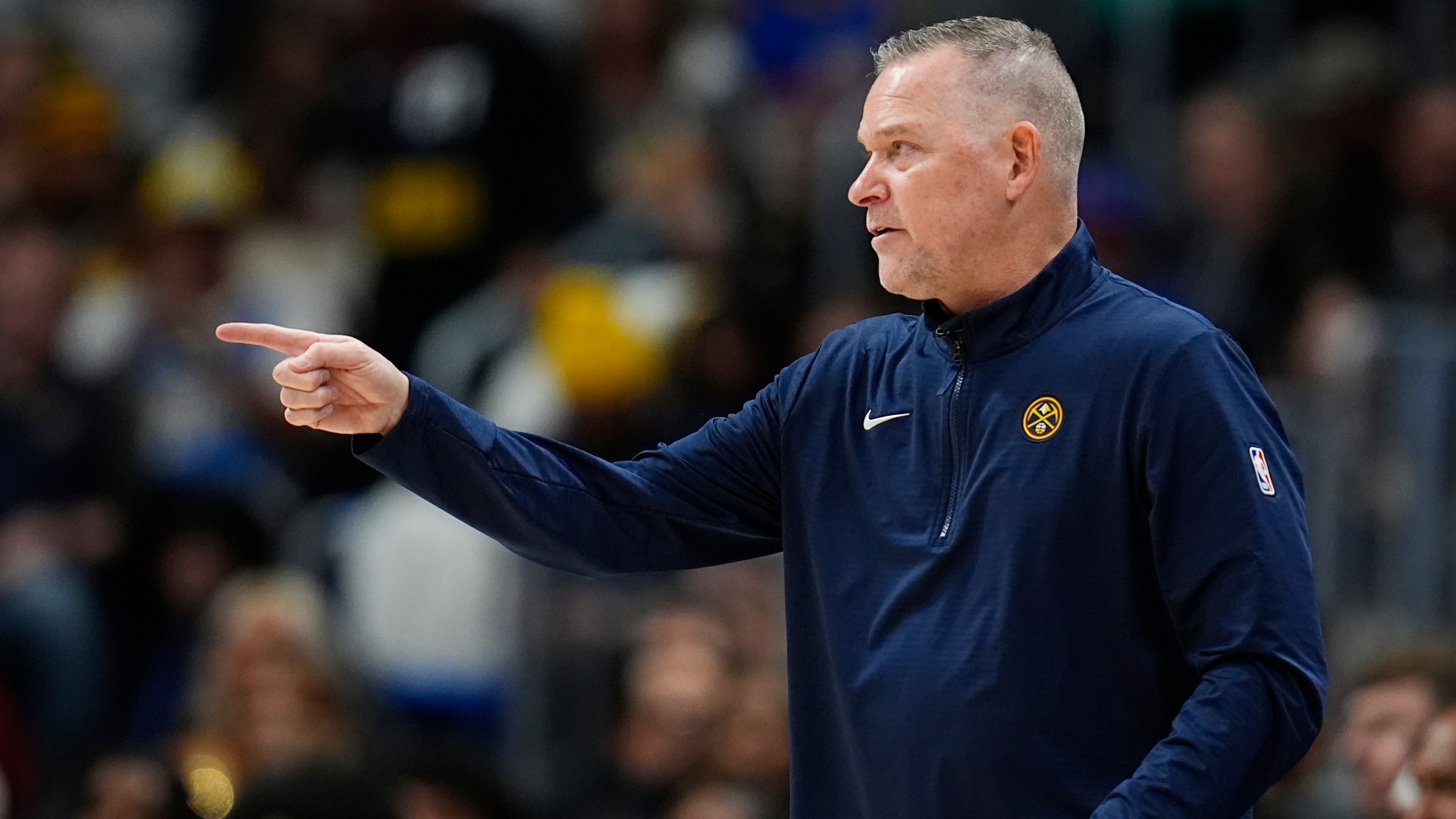 Denver Nuggets head coach Michael Malone directs his team against the Oklahoma City Thunder in the second half of an NBA basketball game Thursday, Oct. 24, 2024, in Denver. (AP Photo/David Zalubowski)