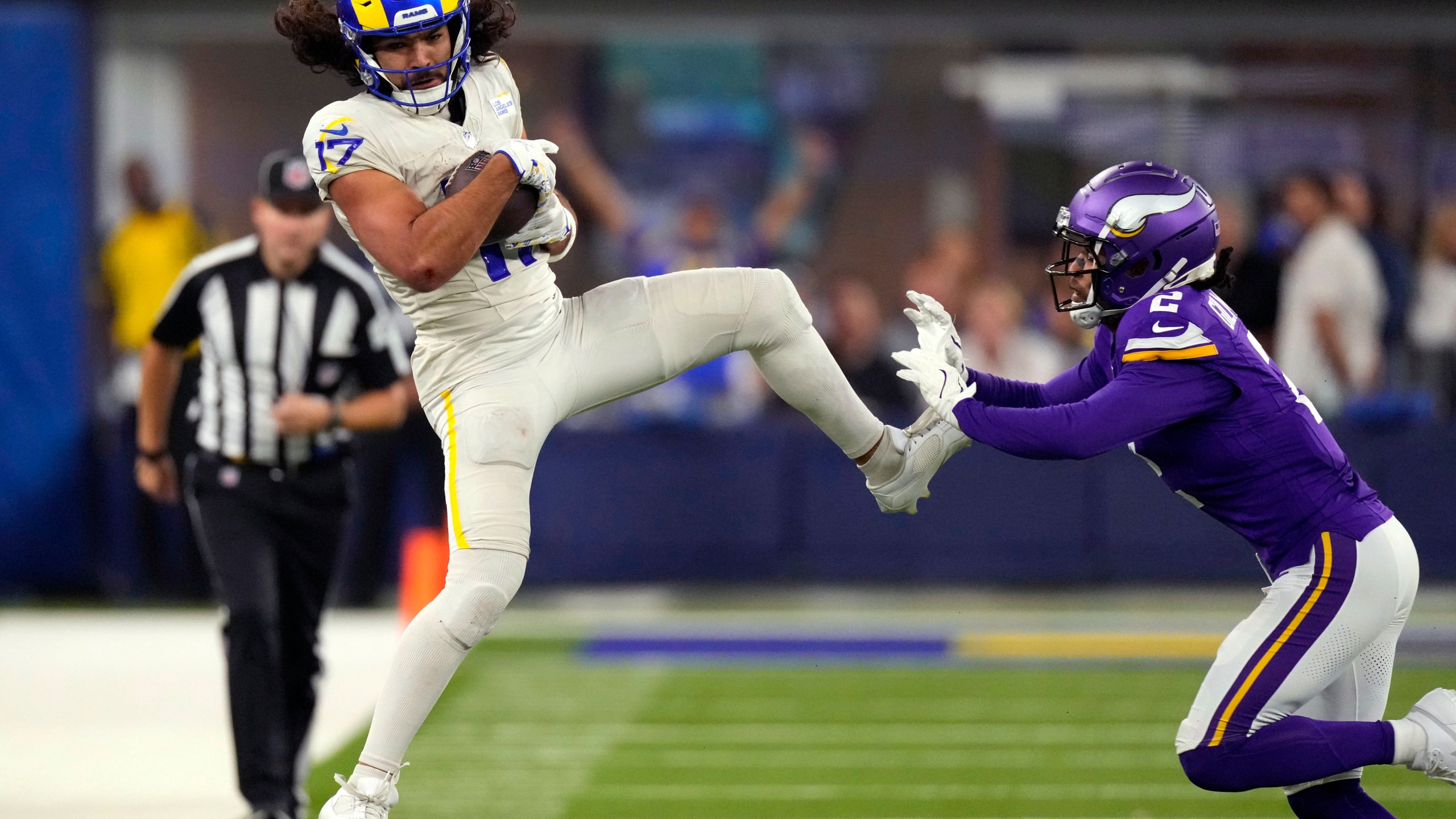 Los Angeles Rams wide receiver Puka Nacua (17) catches a pass as Minnesota Vikings cornerback Stephon Gilmore (2) defends during the second half of an NFL football game Thursday, Oct. 24, 2024, in Inglewood, Calif. (AP Photo/Mark J. Terrill)