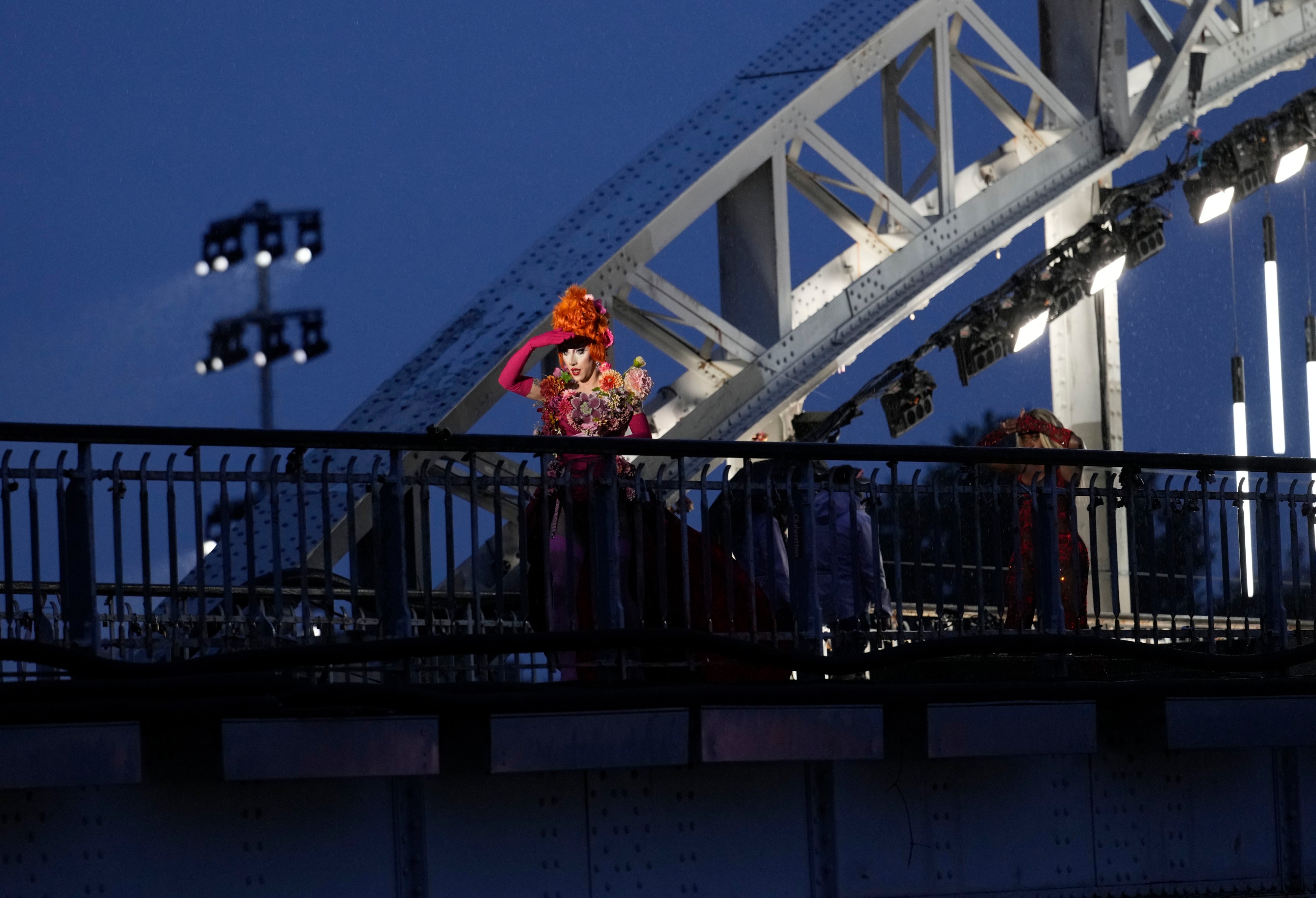 FILE - Drag queens prepare to perform on the Debilly Bridge in Paris, during the opening ceremony of the 2024 Summer Olympics, Friday, July 26, 2024. (AP Photo/Tsvangirayi Mukwazhi, File)