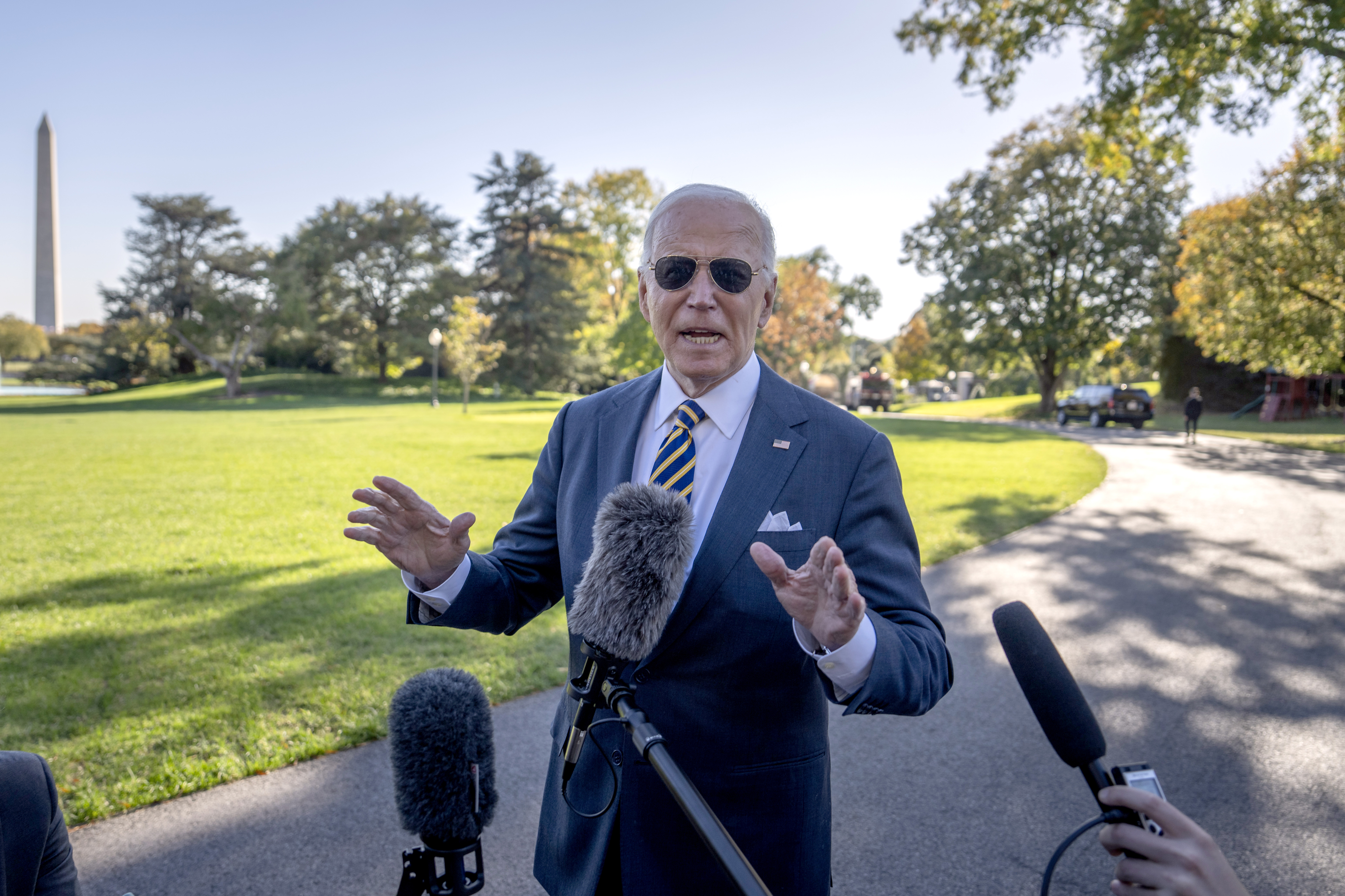 President Joe Biden stops to speak to the media as he walks to board Marine One at the South Lawn of the White House in Washington, Thursday, Oct. 24, 2024. (AP Photo/Ben Curtis)