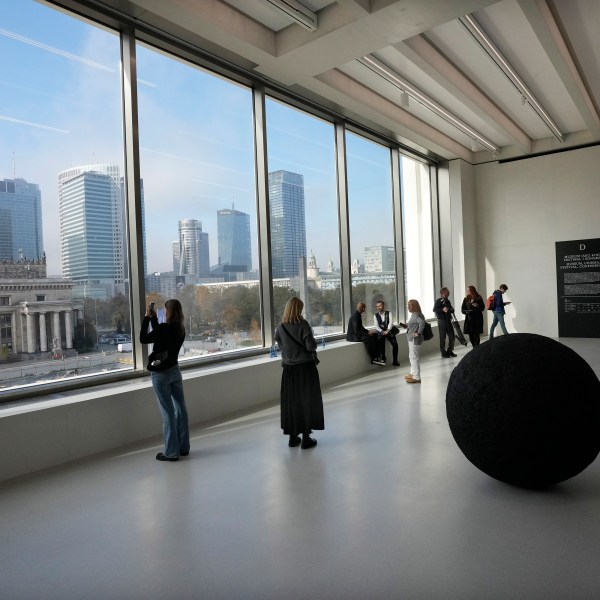 People look out of the window of the Museum of Modern Art in Warsaw, Poland, on Thursday Oct. 24, 2024. (AP Photo/Czarek Sokolowski)