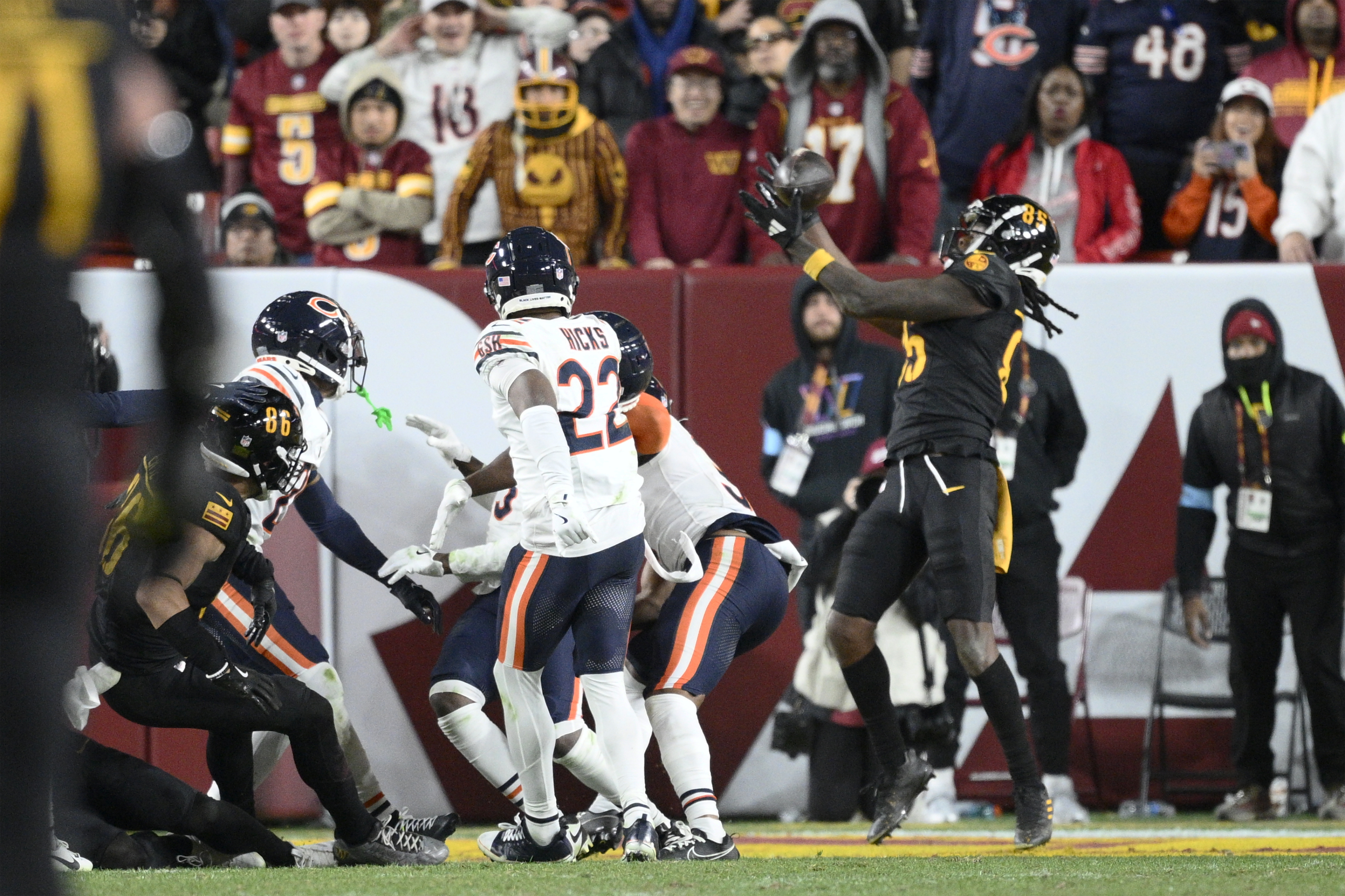 Washington Commanders wide receiver Noah Brown (85) catches a 52-yard touchdown pass in the end zone as time expires to give the Commanders an 18-15 win over the Chicago Bears in an NFL football game Sunday, Oct. 27, 2024, in Landover, Md. (AP Photo/Nick Wass)