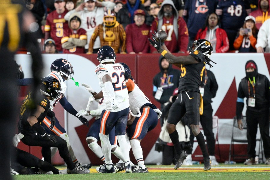 Washington Commanders wide receiver Noah Brown (85) catches a 52-yard touchdown pass in the end zone as time expires to give the Commanders an 18-15 win over the Chicago Bears in an NFL football game Sunday, Oct. 27, 2024, in Landover, Md. (AP Photo/Nick Wass)