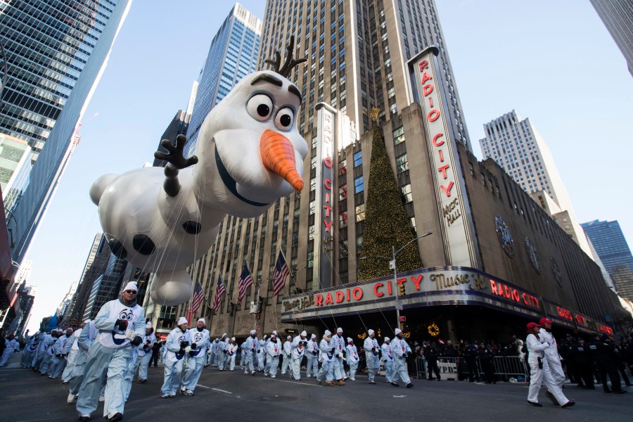 FILE - In this Nov. 22, 2018 file photo, the Olaf balloon floats past Radio City Music Hall during the 92nd annual Macy's Thanksgiving Day Parade in New York. (AP Photo/Mary Altaffer, File)