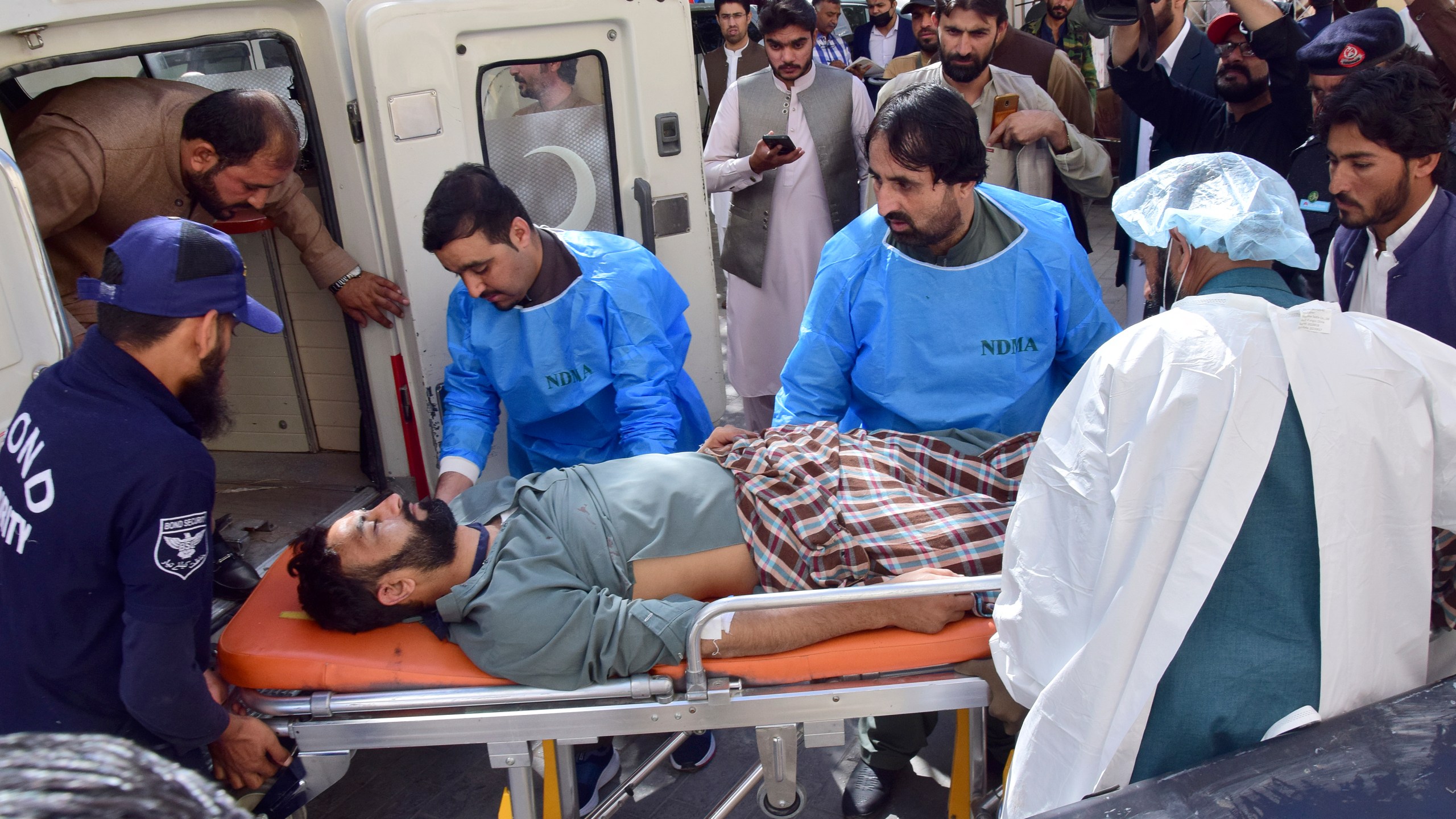 Paramedics and volunteers transport an injured victim of a bomb explosion in Mastung town, upon arrival at a hospital in Quetta, Pakistan, Friday, Nov. 1, 2024. (AP Photo/Arshad Butt)