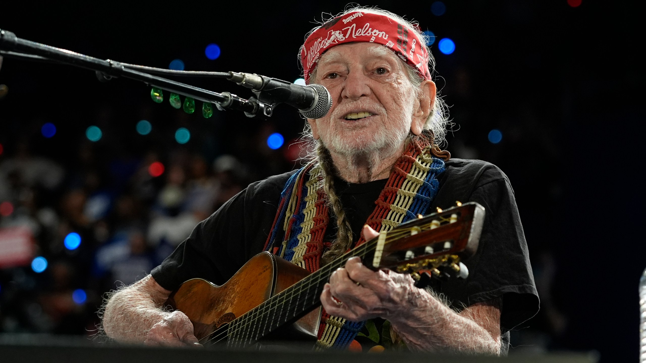 Musician Willie Nelson performing ahead of event for Democratic presidential nominee Vice President Kamala Harris at a rally in Houston, Friday, Oct. 25, 2024. (AP Photo/Susan Walsh)