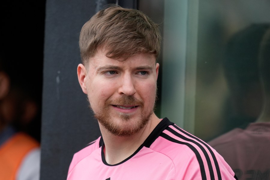 FILE - Jimmy Donaldson, the popular YouTube video maker who goes by MrBeast, wears a Lionel Messi jersey as he stands in a sideline box at the start of an MLS soccer match between Inter Miami and CF Montreal, March 10, 2024, in Fort Lauderdale, Fla. (AP Photo/Rebecca Blackwell, File)