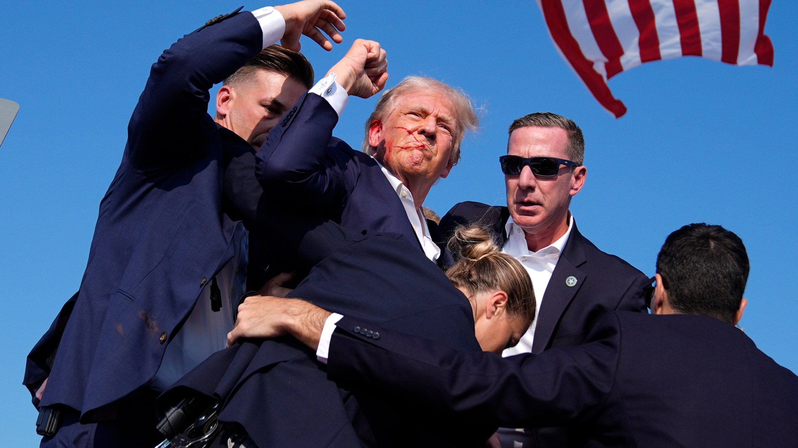 Republican presidential candidate former President Donald Trump is surrounded by U.S. Secret Service agents at a campaign rally, July 13, 2024, in Butler, Pa. (AP Photo/Evan Vucci, File)