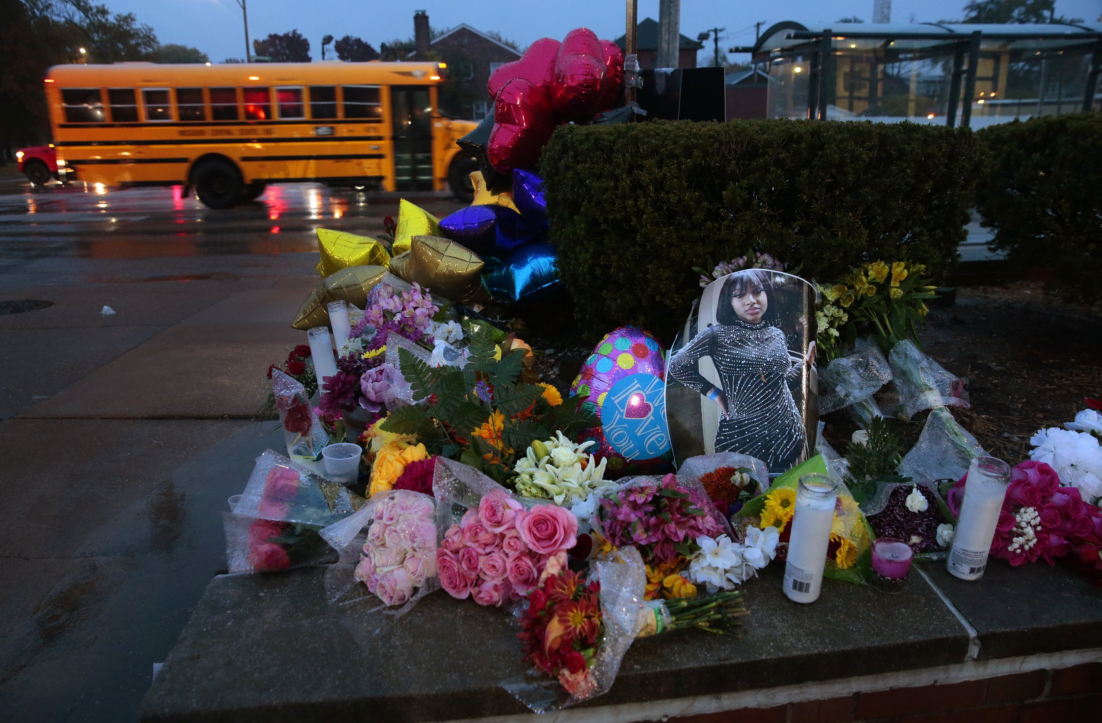 FILE - A photo of Alexandria Bell rests at the scene of a growing floral memorial to the victims of a school shooting at Central Visual & Performing Arts High School, Oct. 25, 2022, in St. Louis. (Robert Cohen/St. Louis Post-Dispatch via AP, File)