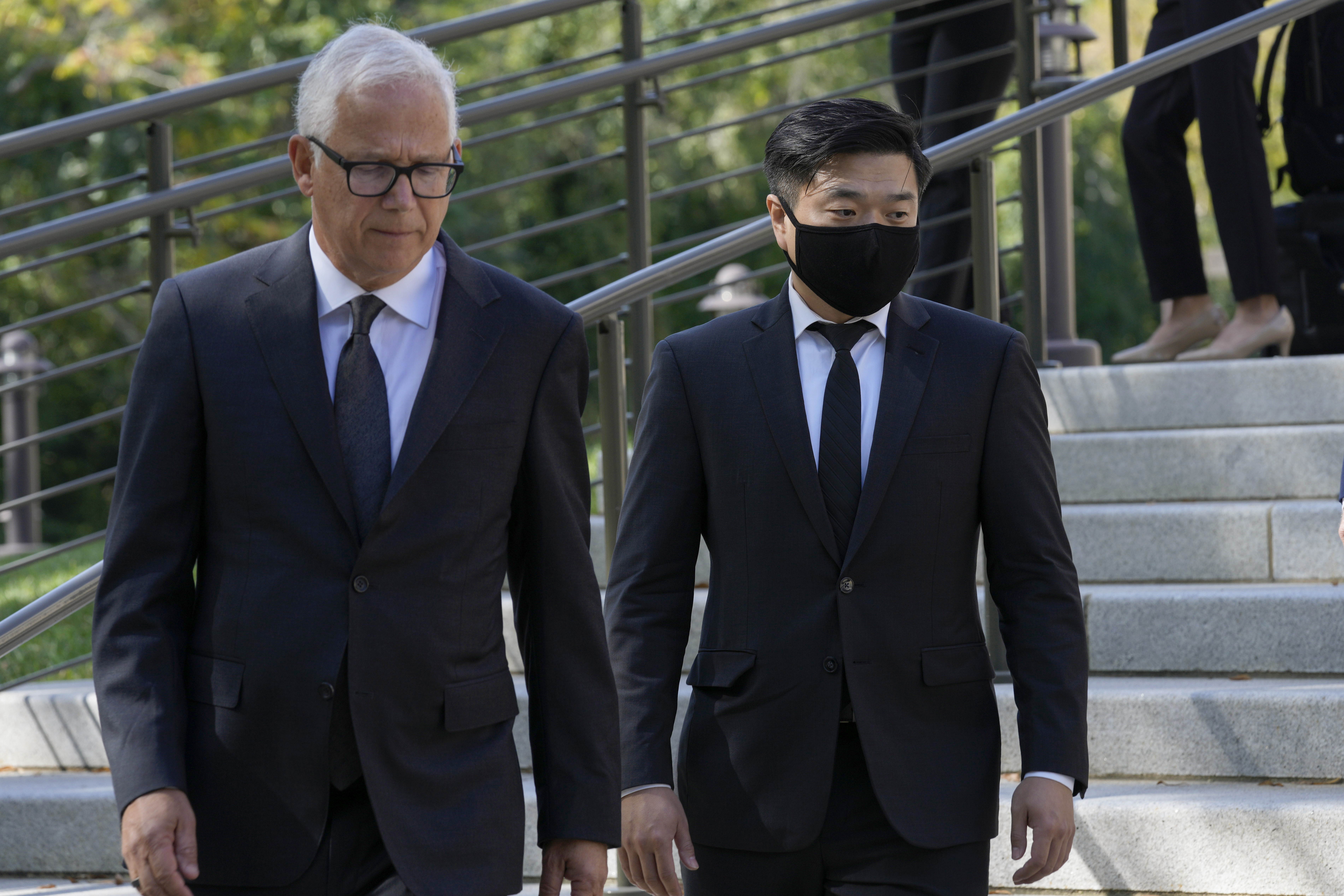 FILE - Attorney David Sanford, left, and Young Lee, right, brother of murder victim Hae Min Lee, walk over to talk with reporters outside Maryland's Supreme Court in Annapolis, Md., Oct. 5, 2023, following arguments in an appeal by Adnan Syed, whose conviction for killing his ex-girlfriend Hae Min Lee more than 20 years ago was chronicled in the hit podcast "Serial." (AP Photo/Susan Walsh, File)