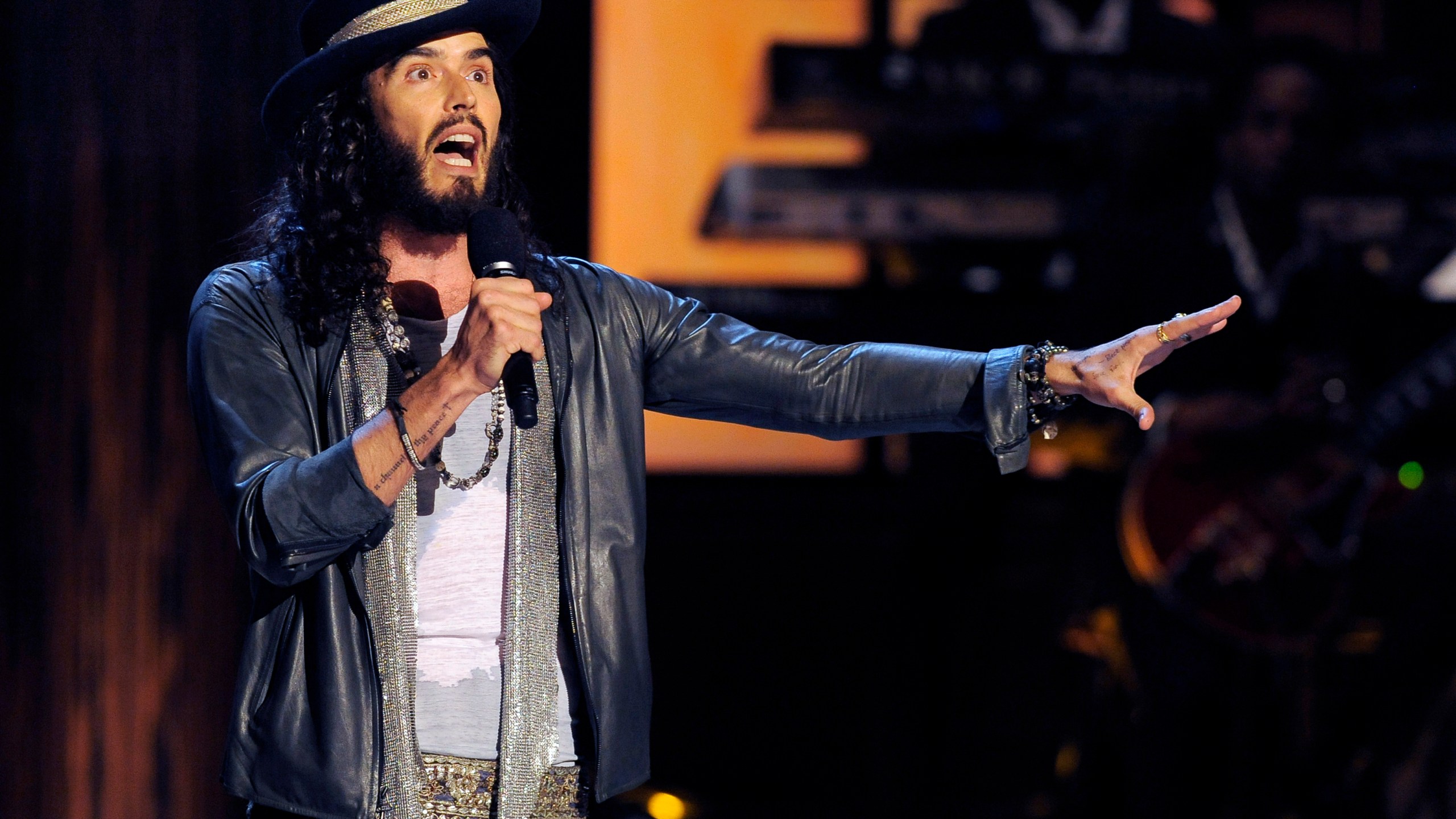 FILE - Comedian Russell Brand performs at "Eddie Murphy: One Night Only," a celebration of Murphy's career, at the Saban Theater in Beverly Hills, Calif on Nov. 3, 2012. (Photo by Chris Pizzello/Invision/AP, File)