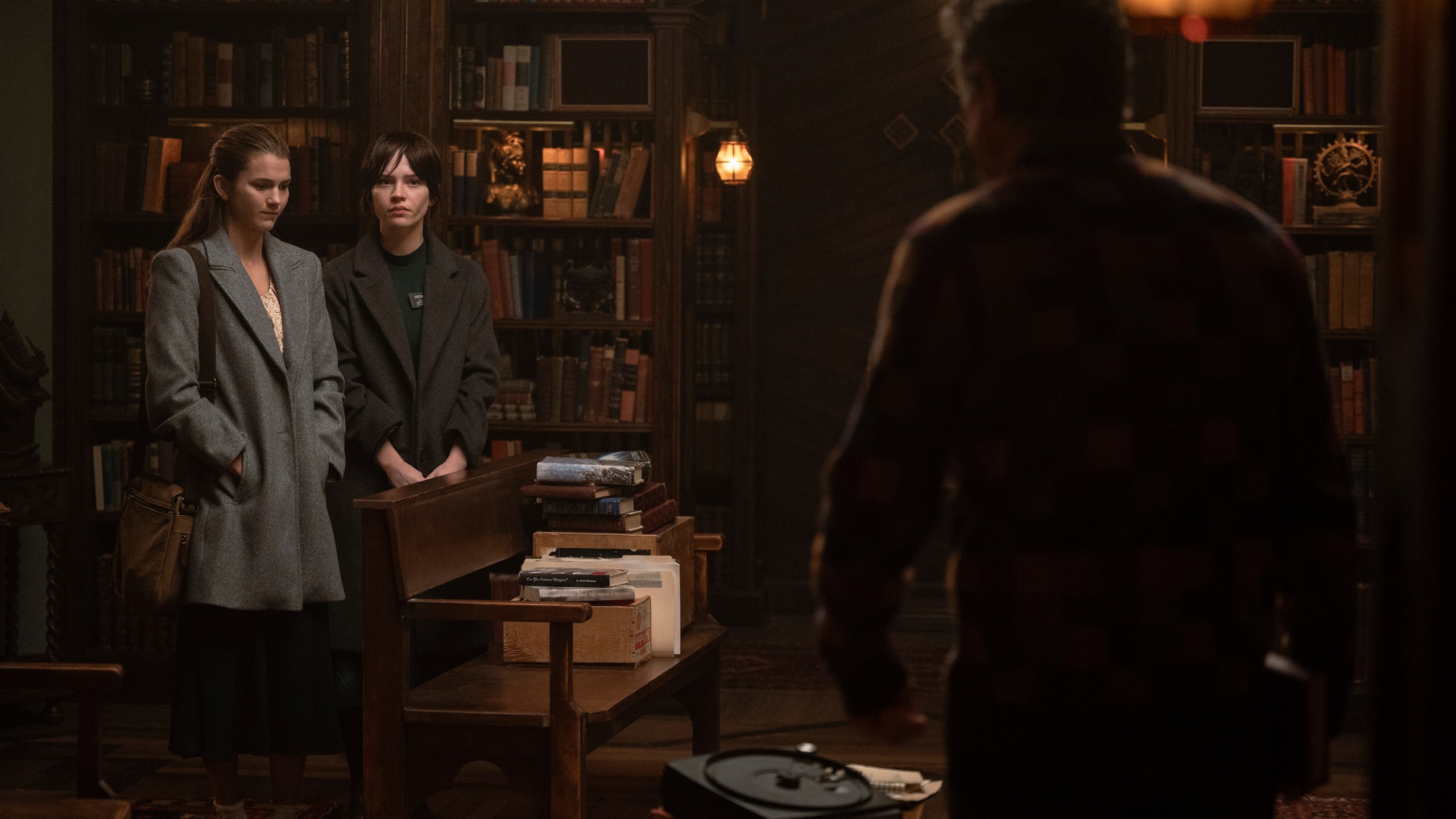 This image released by A24 shows, from left, Chloe East, Sophie Thatcher, and Hugh Grant in a scene from "Heretic." (Kimberley French/A24 via AP)