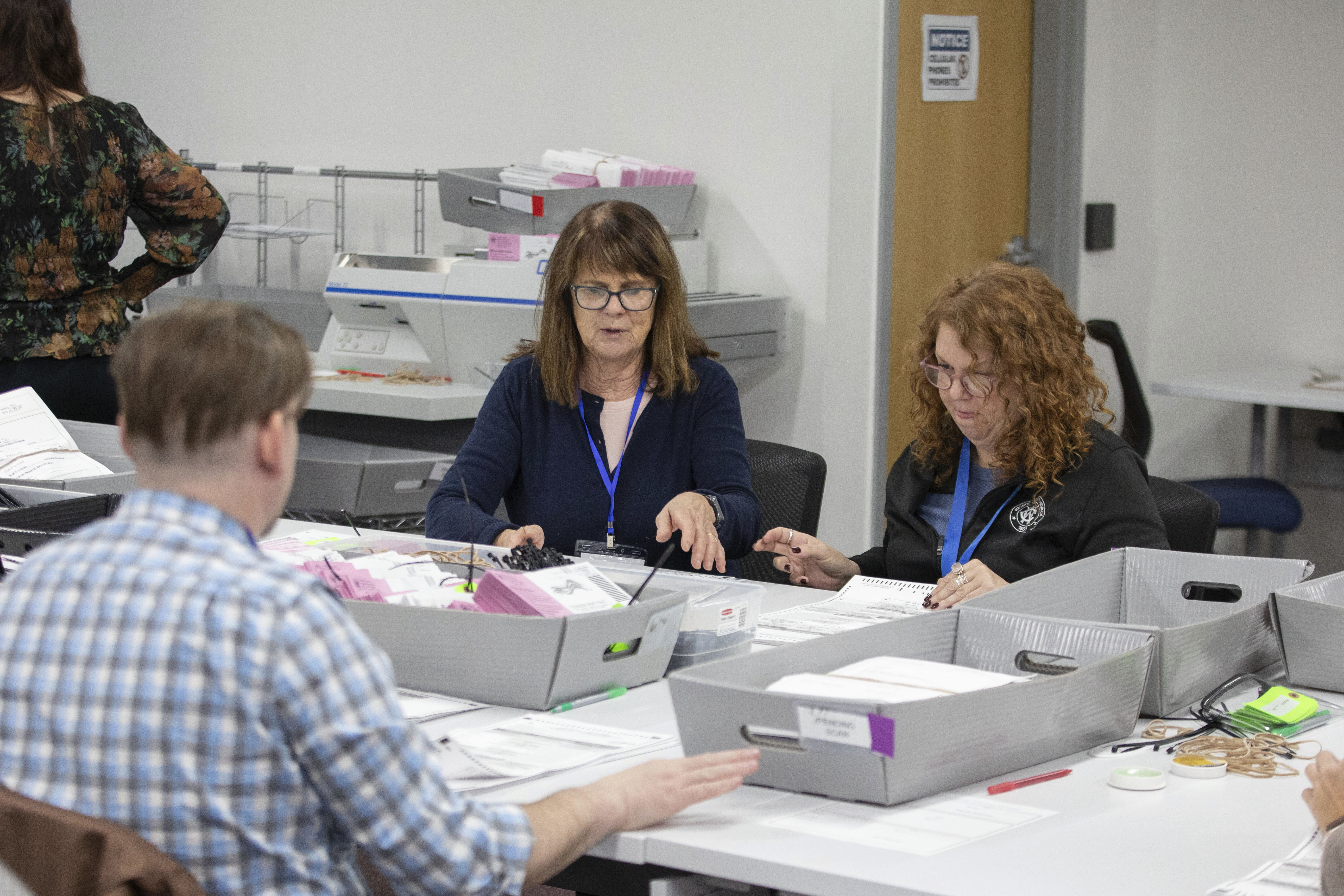 Washoe County election workers sort ballots at the Registrar of Voters Office in Reno, Nev., Tuesday, Oct. 29, 2024. (AP Photo/Tom R. Smedes)