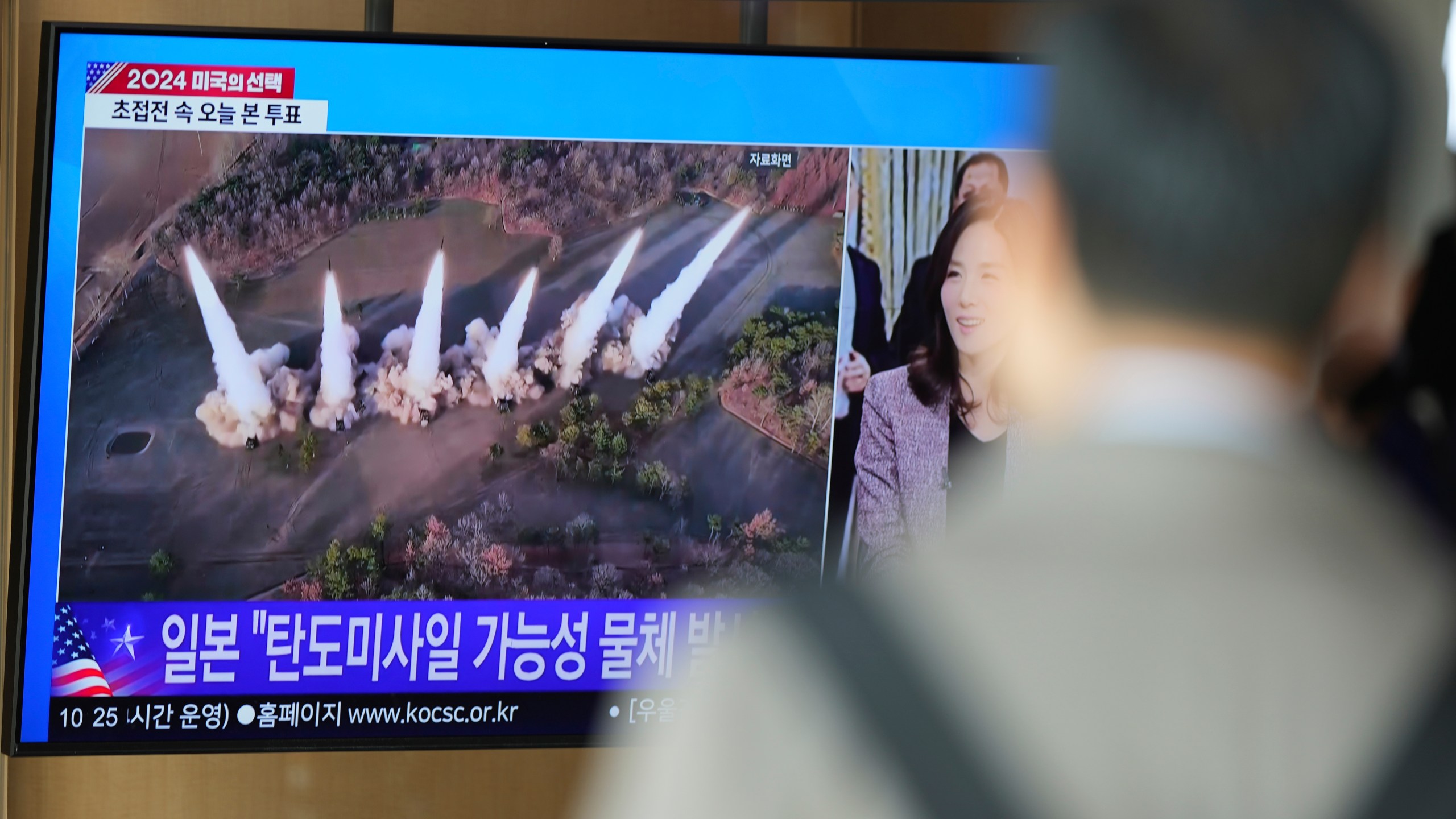 A TV screen shows a report of North Korea's multiple short-range ballistic missiles with file footage during a news program at the Seoul Railway Station in Seoul, South Korea, Tuesday, Nov. 5, 2024. (AP Photo/Lee Jin-man)