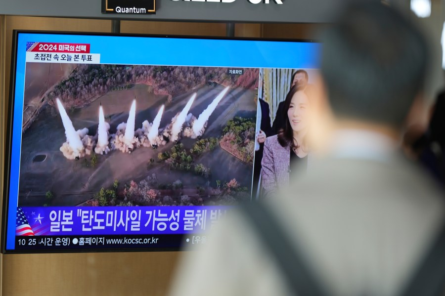 A TV screen shows a report of North Korea's multiple short-range ballistic missiles with file footage during a news program at the Seoul Railway Station in Seoul, South Korea, Tuesday, Nov. 5, 2024. (AP Photo/Lee Jin-man)