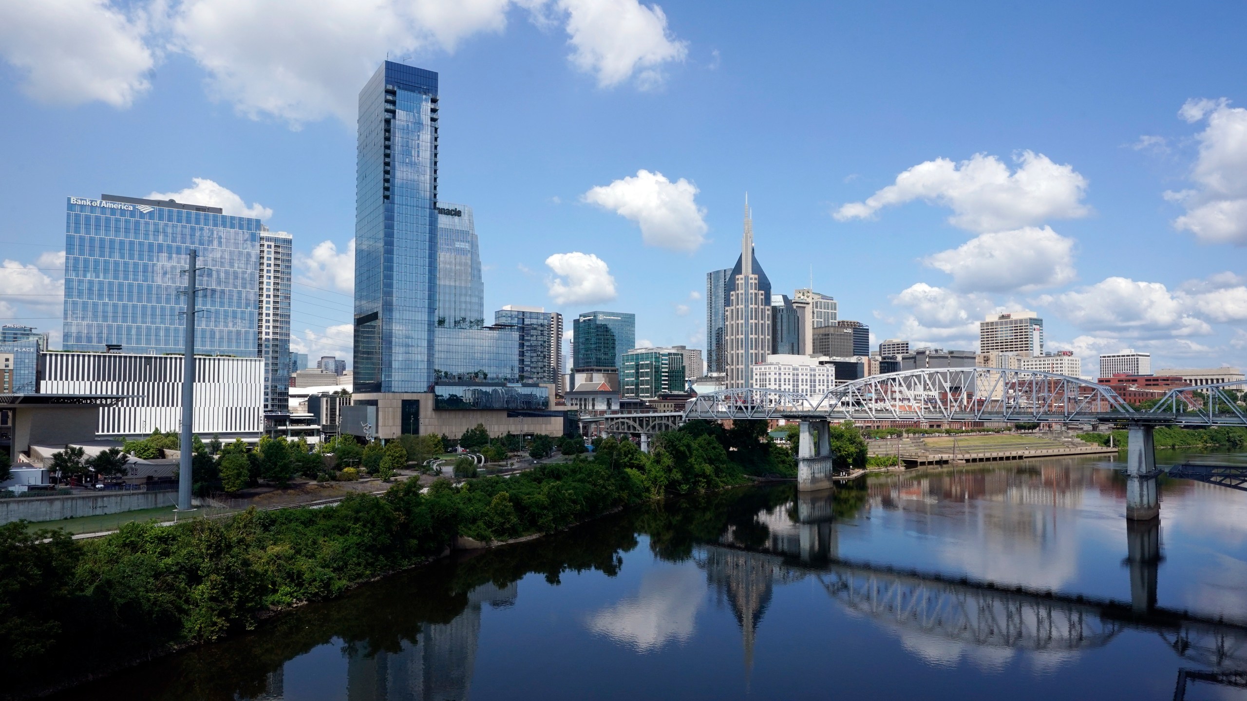 FILE - The Nashville, Tenn., skyline is reflected in the Cumberland River July 11, 2022. (AP Photo/Mark Humphrey, File)