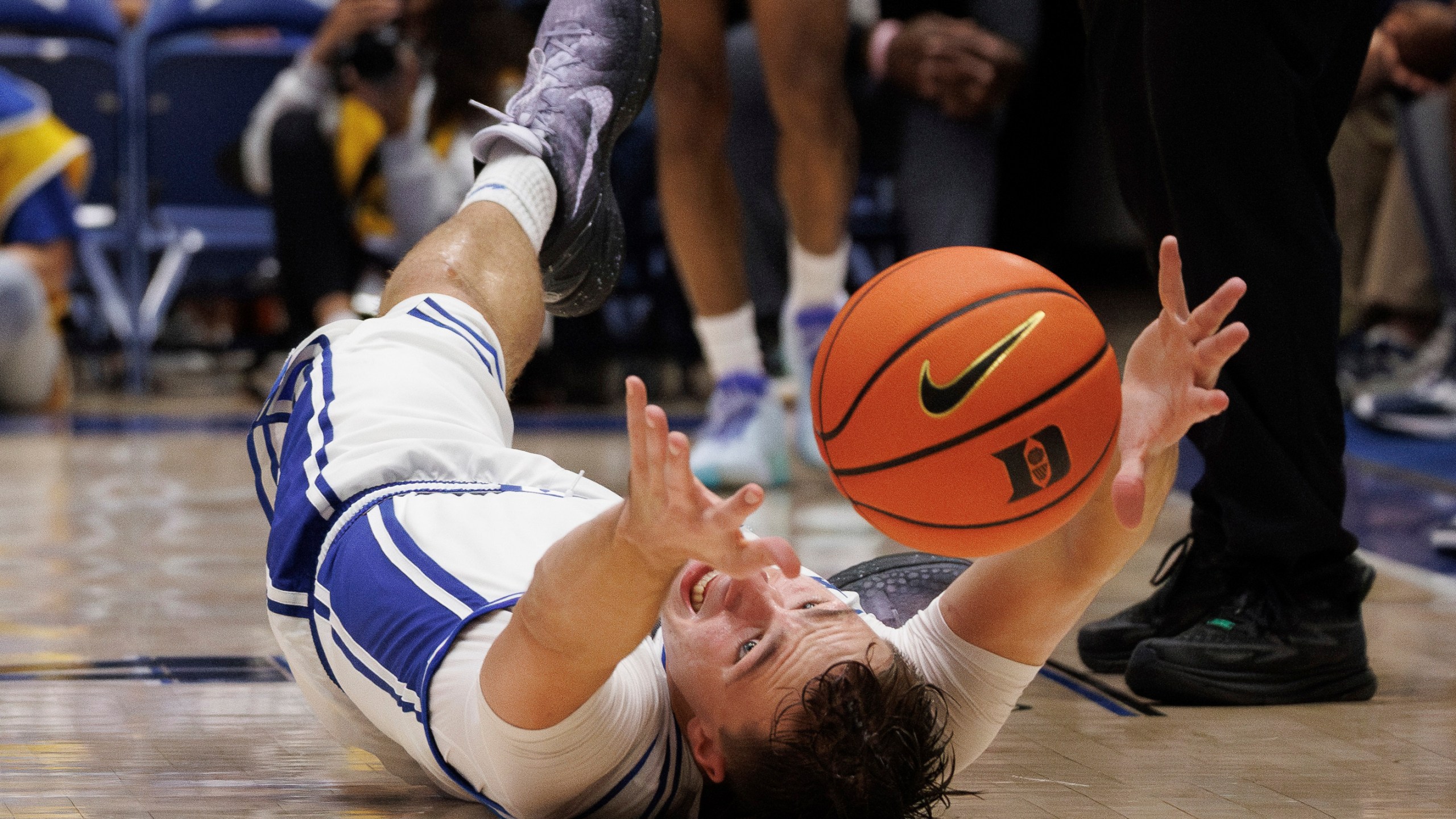 Duke's Cooper Flagg (2) dives for a loose ball during the second half of an NCAA college basketball game against Maine in Durham, N.C., Monday, Nov. 4, 2024. (AP Photo/Ben McKeown)