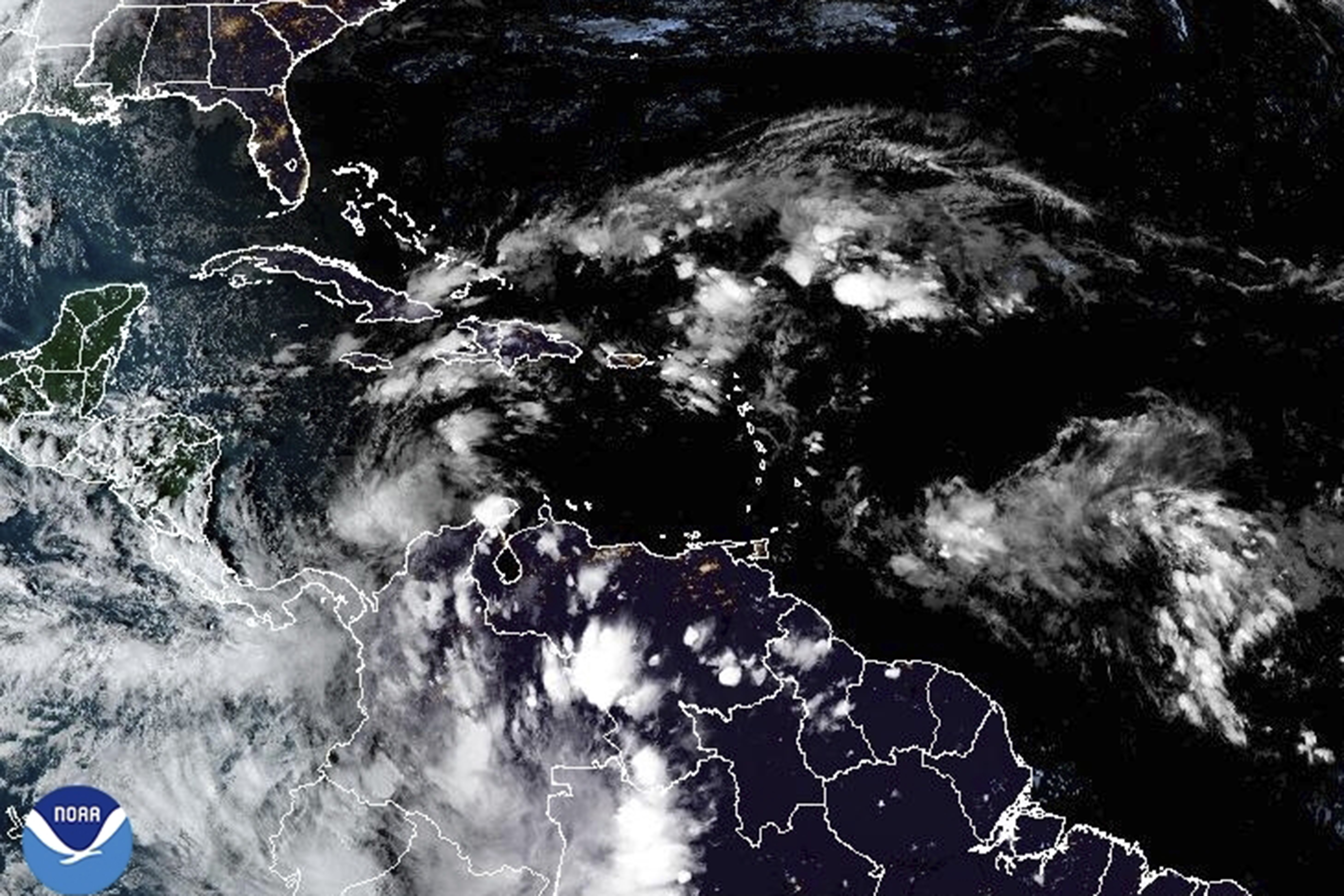 This satellite image provided by NOAA shows weather systems Sunday, Nov. 3, 2024. (NOAA via AP)