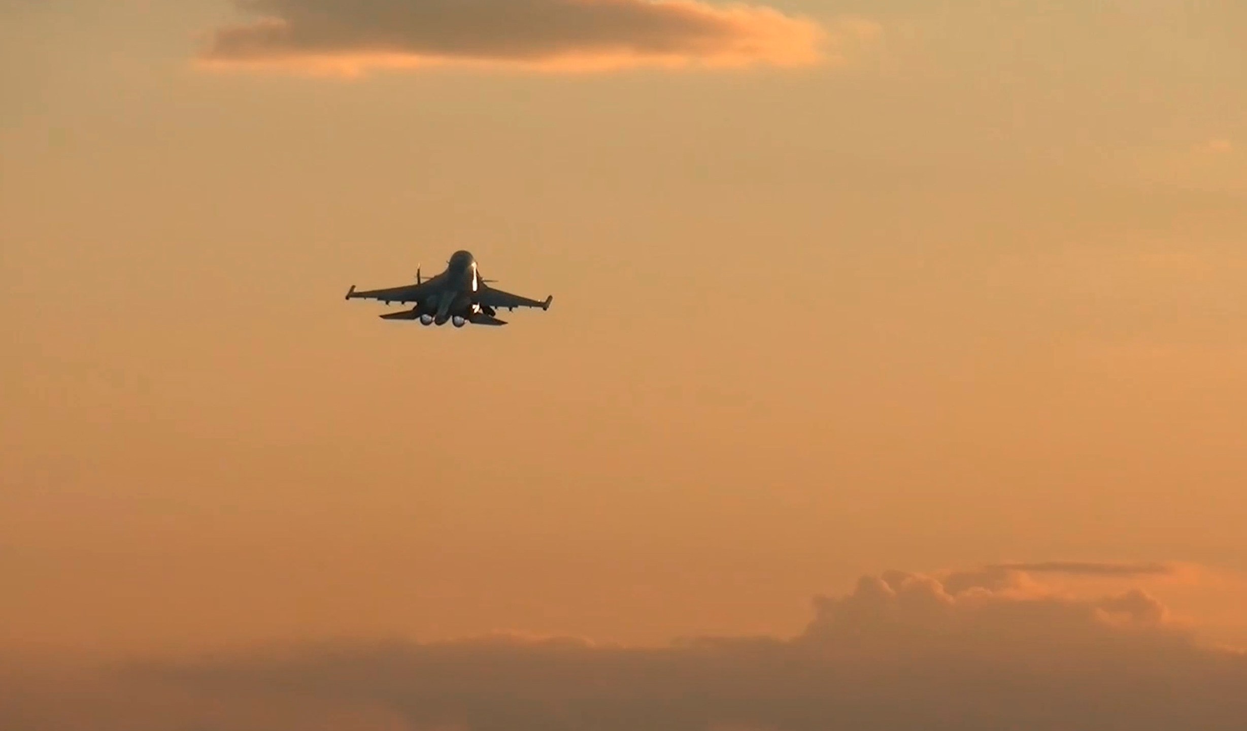 In this photo taken from a video released by Russian Defense Ministry press service on Tuesday, Nov. 5, 2024, a Su-34 bomber of the Russian air force operates at the border area of Kursk region, Russia. (Russian Defense Ministry Press Service via AP)