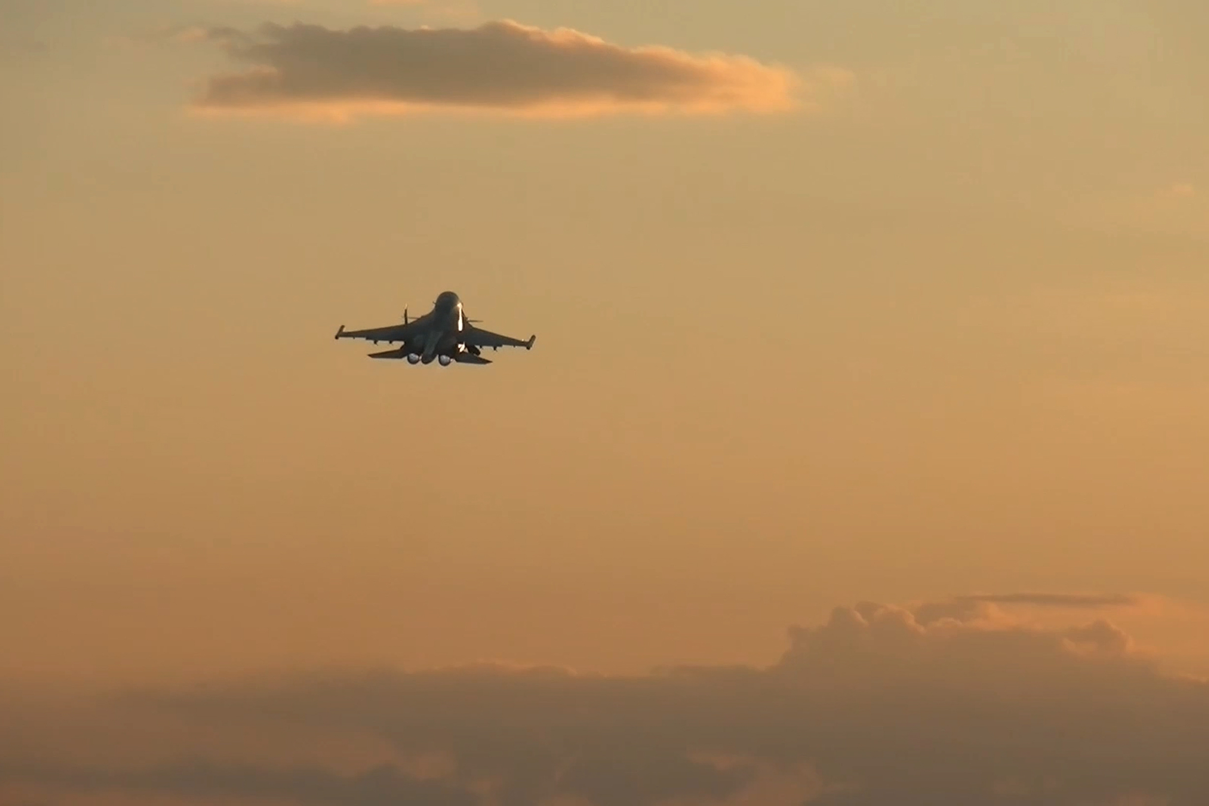 In this photo taken from a video released by Russian Defense Ministry press service on Tuesday, Nov. 5, 2024, a Su-34 bomber of the Russian air force operates at the border area of Kursk region, Russia. (Russian Defense Ministry Press Service via AP)