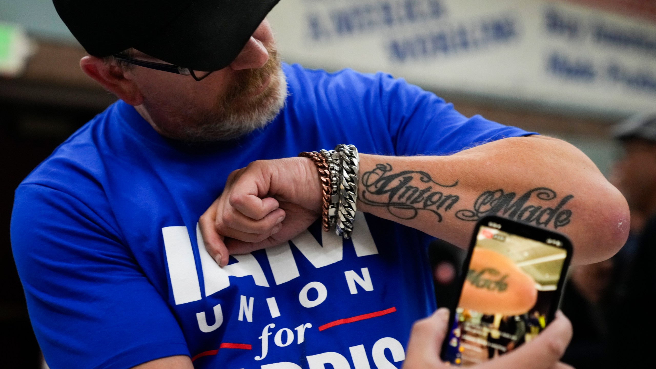 Ed Lutgen shows off his tattoo while waiting to hear the results of the union vote on a new contract offer from Boeing, Monday, Nov. 4, 2024, at IAM District 751 Union Hall in Seattle. (AP Photo/Lindsey Wasson)