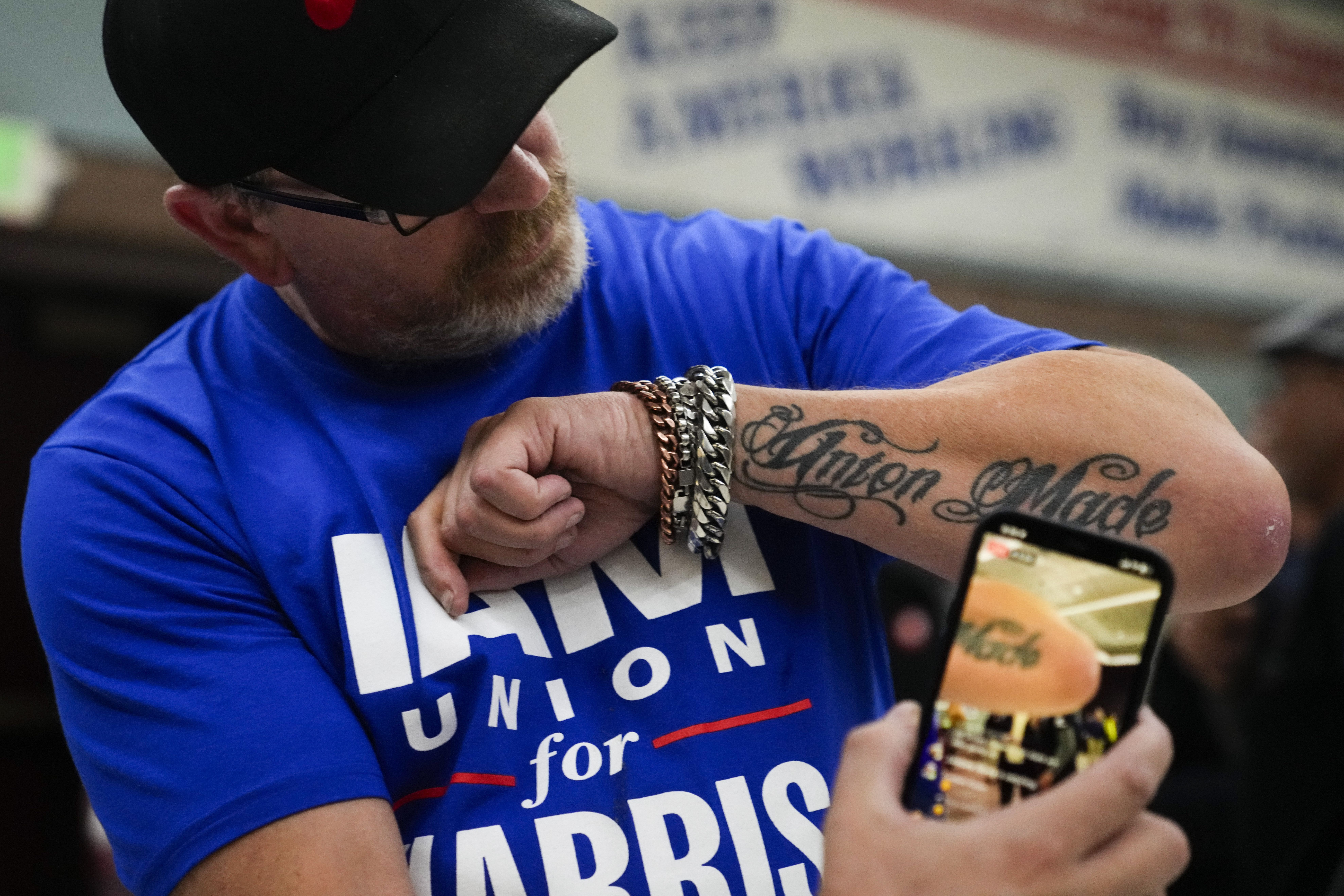 Ed Lutgen shows off his tattoo while waiting to hear the results of the union vote on a new contract offer from Boeing, Monday, Nov. 4, 2024, at IAM District 751 Union Hall in Seattle. (AP Photo/Lindsey Wasson)