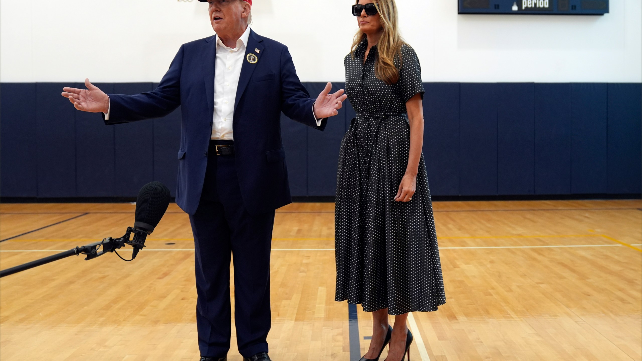 Republican presidential nominee former President Donald Trump speaks as former first lady Melania Trump listens after they voted on Election Day at the Morton and Barbara Mandel Recreation Center, Tuesday, Nov. 5, 2024, in Palm Beach, Fla. (AP Photo/Evan Vucci)