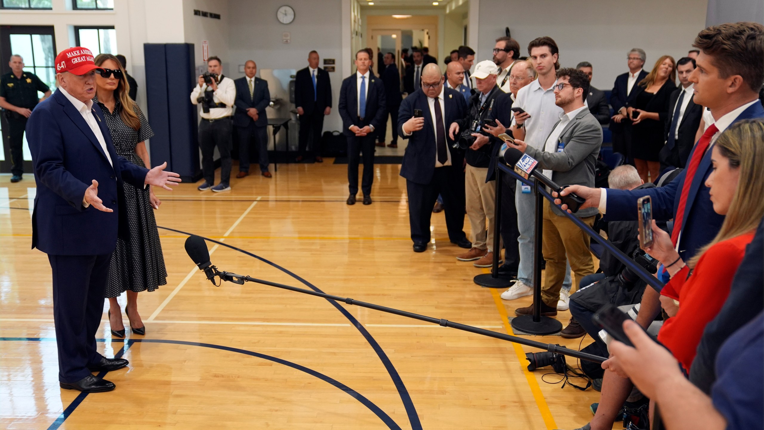 Republican presidential nominee former President Donald Trump speaks as former first lady Melania Trump listens after they voted on Election Day at the Morton and Barbara Mandel Recreation Center, Tuesday, Nov. 5, 2024, in Palm Beach, Fla. (AP Photo/Evan Vucci)