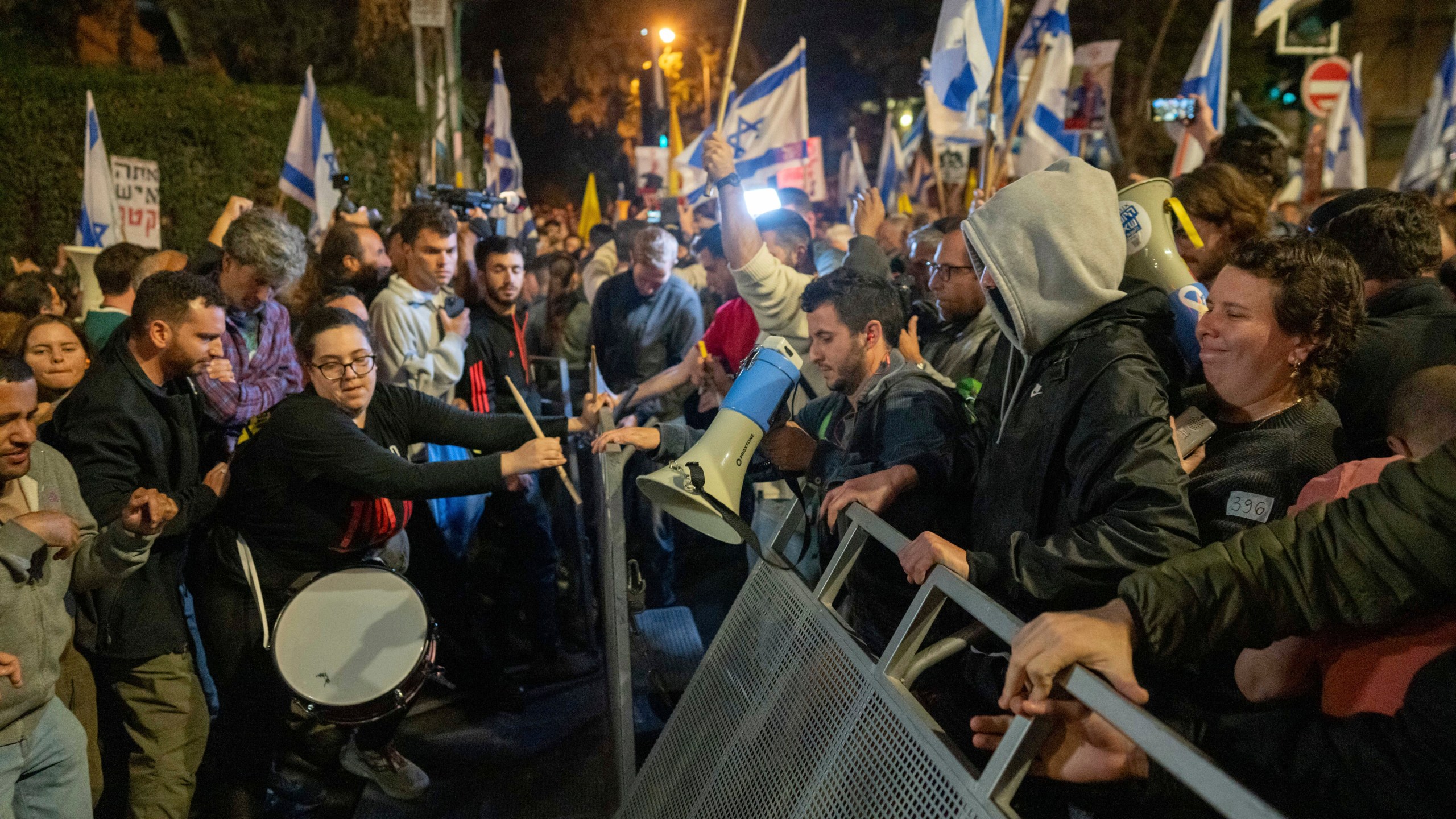 People protest against Prime Minister Benjamin Netanyahu near his residence in Jerusalem after he has dismissed his defense minister Yoav Gallant in a surprise announcement Tuesday, Nov. 5, 2024. (AP Photo/Ohad Zwigenberg)