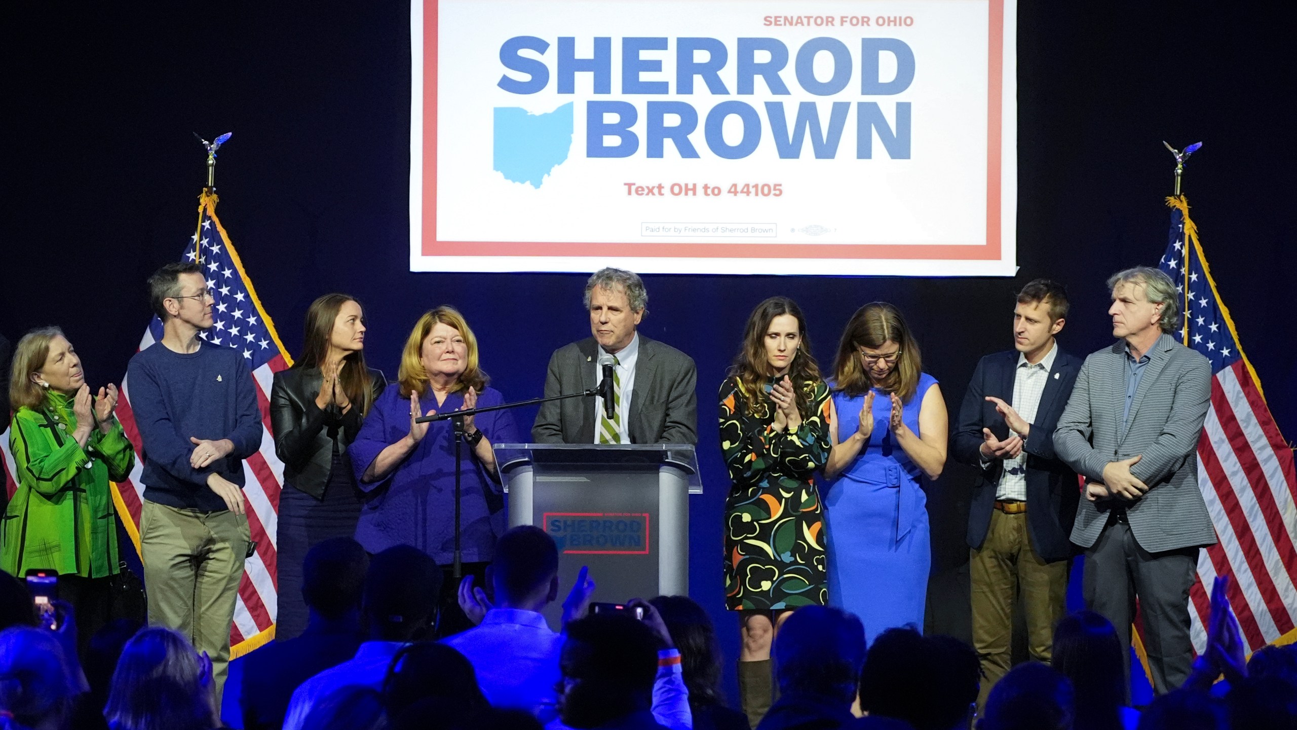 Democratic Ohio Sen. Sherrod Brown speaks during a watch party on election night, Tuesday, Nov. 5, 2024, in Columbus, Ohio, next to his wife Connie Schultz, left, and his daughter Elizabeth Brown, right, and others. (AP Photo/Joshua A. Bickel)