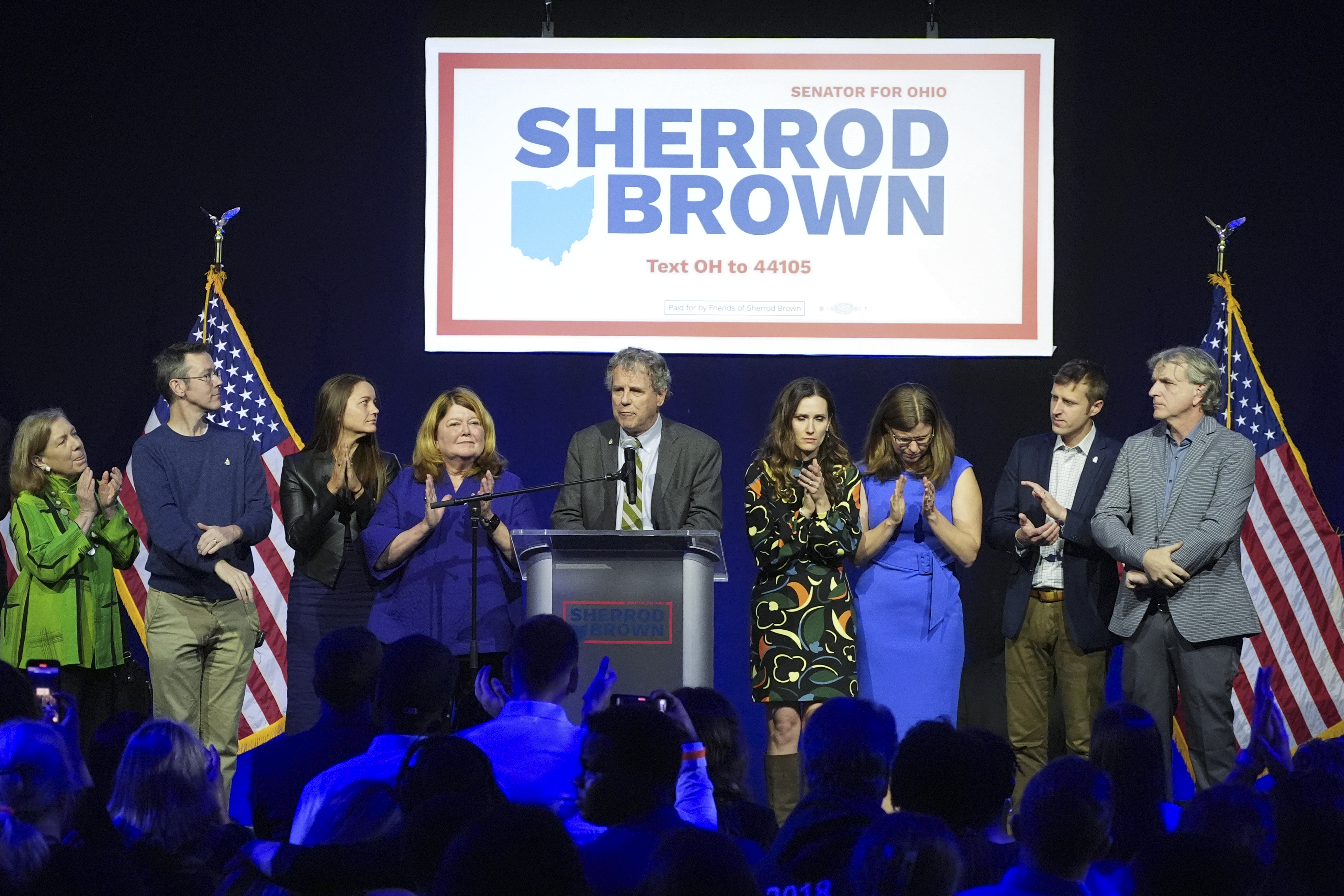 Democratic Ohio Sen. Sherrod Brown speaks during a watch party on election night, Tuesday, Nov. 5, 2024, in Columbus, Ohio, next to his wife Connie Schultz, left, and his daughter Elizabeth Brown, right, and others. (AP Photo/Joshua A. Bickel)