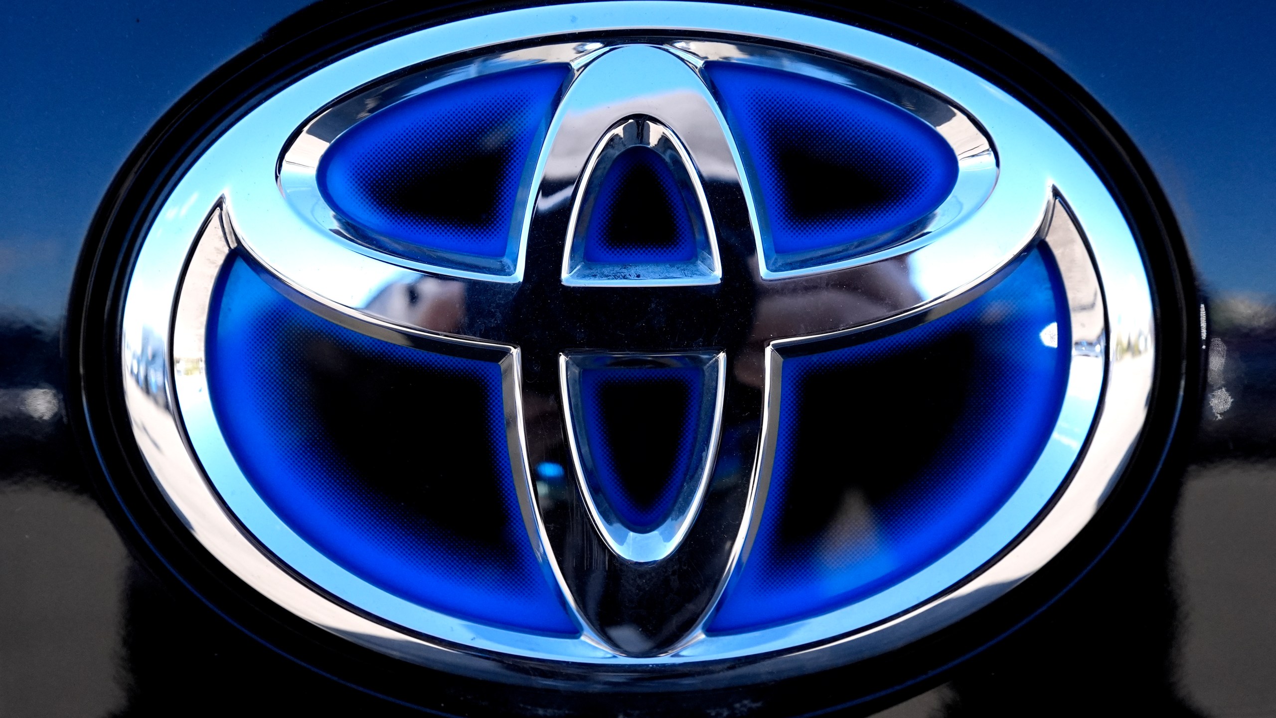 FILE - Toyota logo (Hybrid model) is seen at a new and used vehicles dealership in Palatine, Ill., Tuesday, March 20, 2024. (AP Photo/Nam Y. Huh, File)