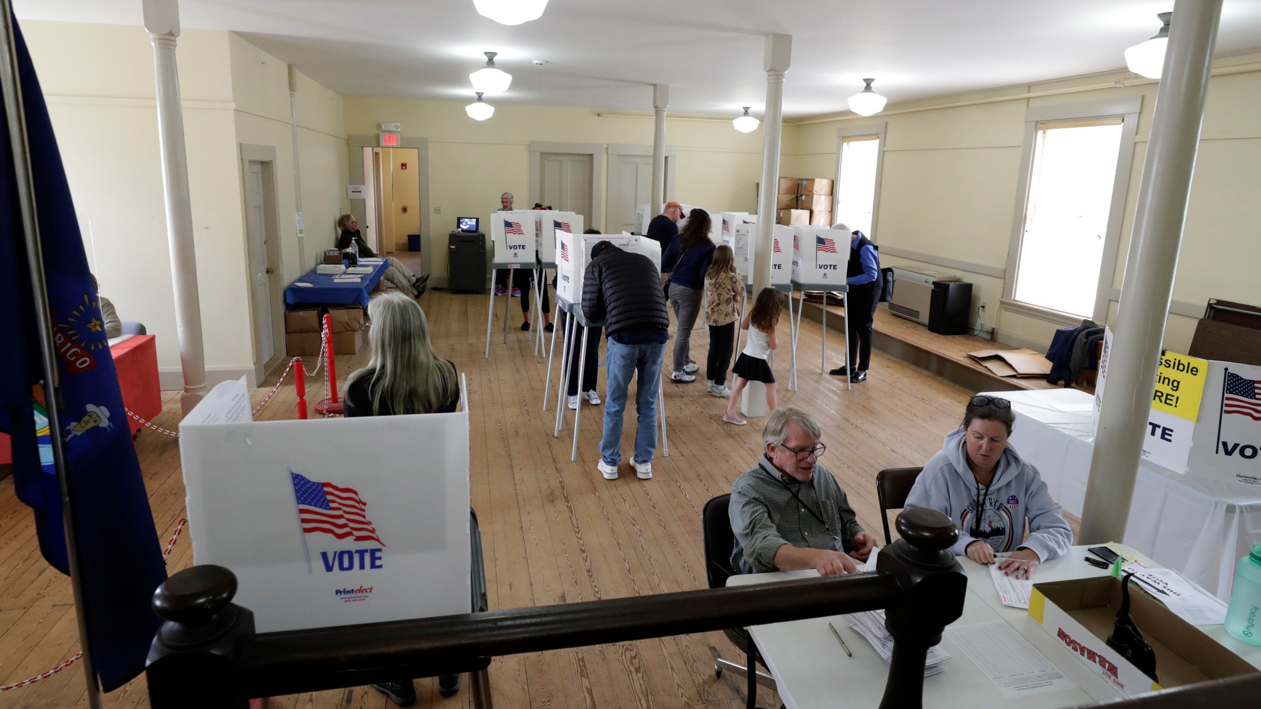 People cast their votes on Election Day, Tuesday, Nov. 5, 2024 in Pownal, Maine. (AP Photo/Joel Page)