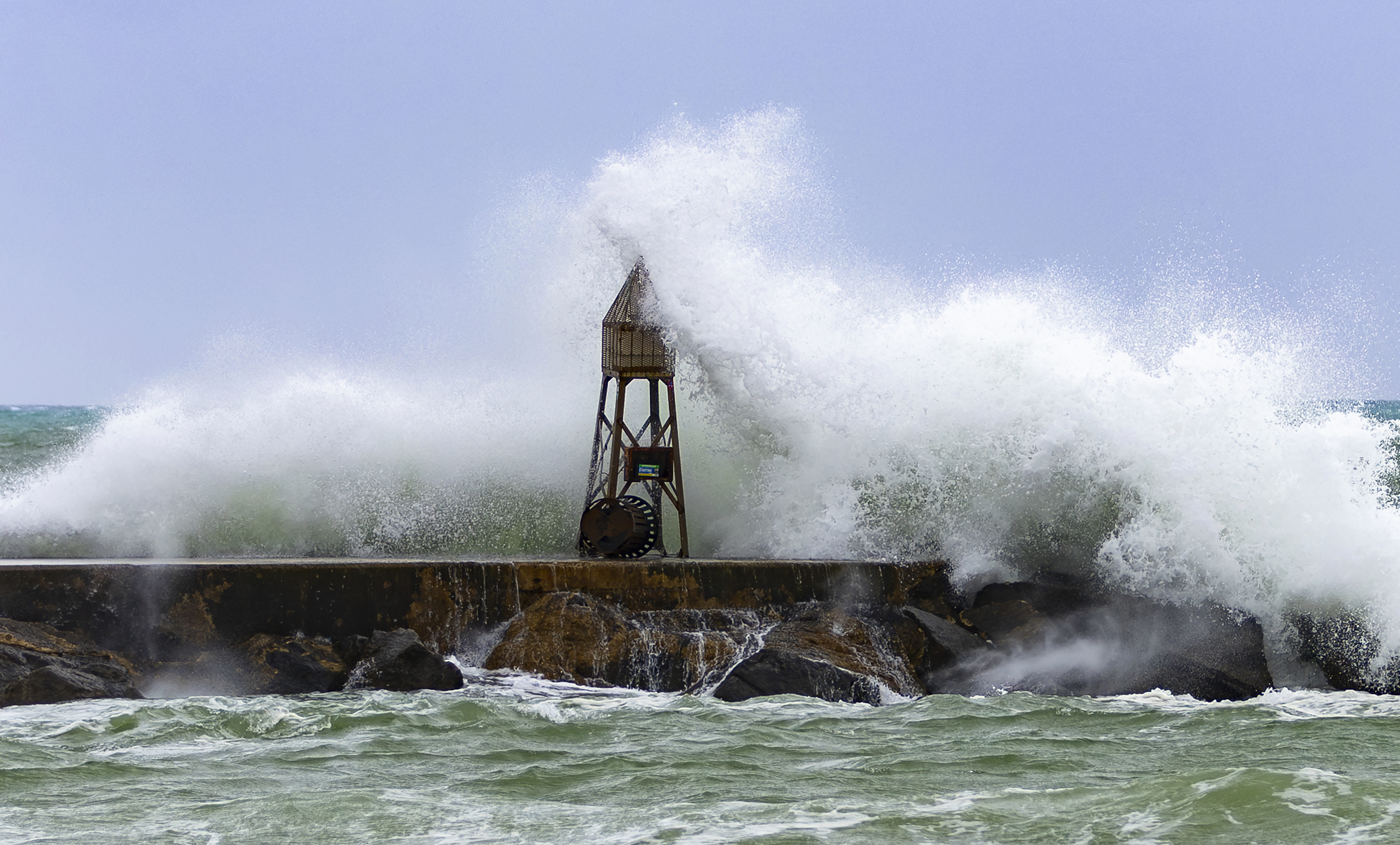 Waves crash against the jetty at the Bal Harbour Lighthouse on Tuesday, Nov. 5, 2024, in Bal Harbour, Fla. (David Santiago/Miami Herald via AP)