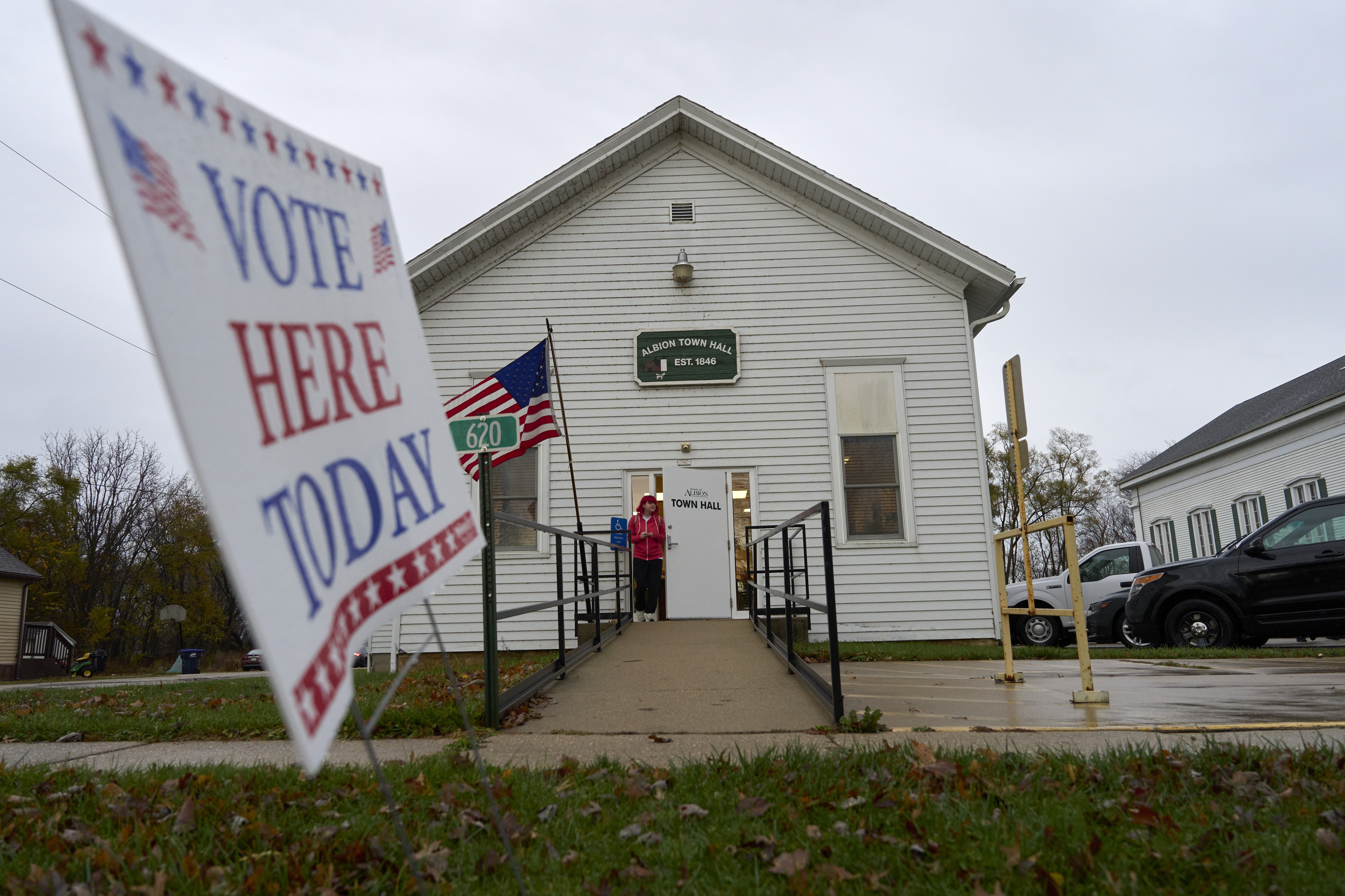 A voter leaves Albion Town hall after casting their ballot on Election Day, Tuesday, Nov. 5, 2024, in Albion, Wis. (AP Photo/Kayla Wolf)