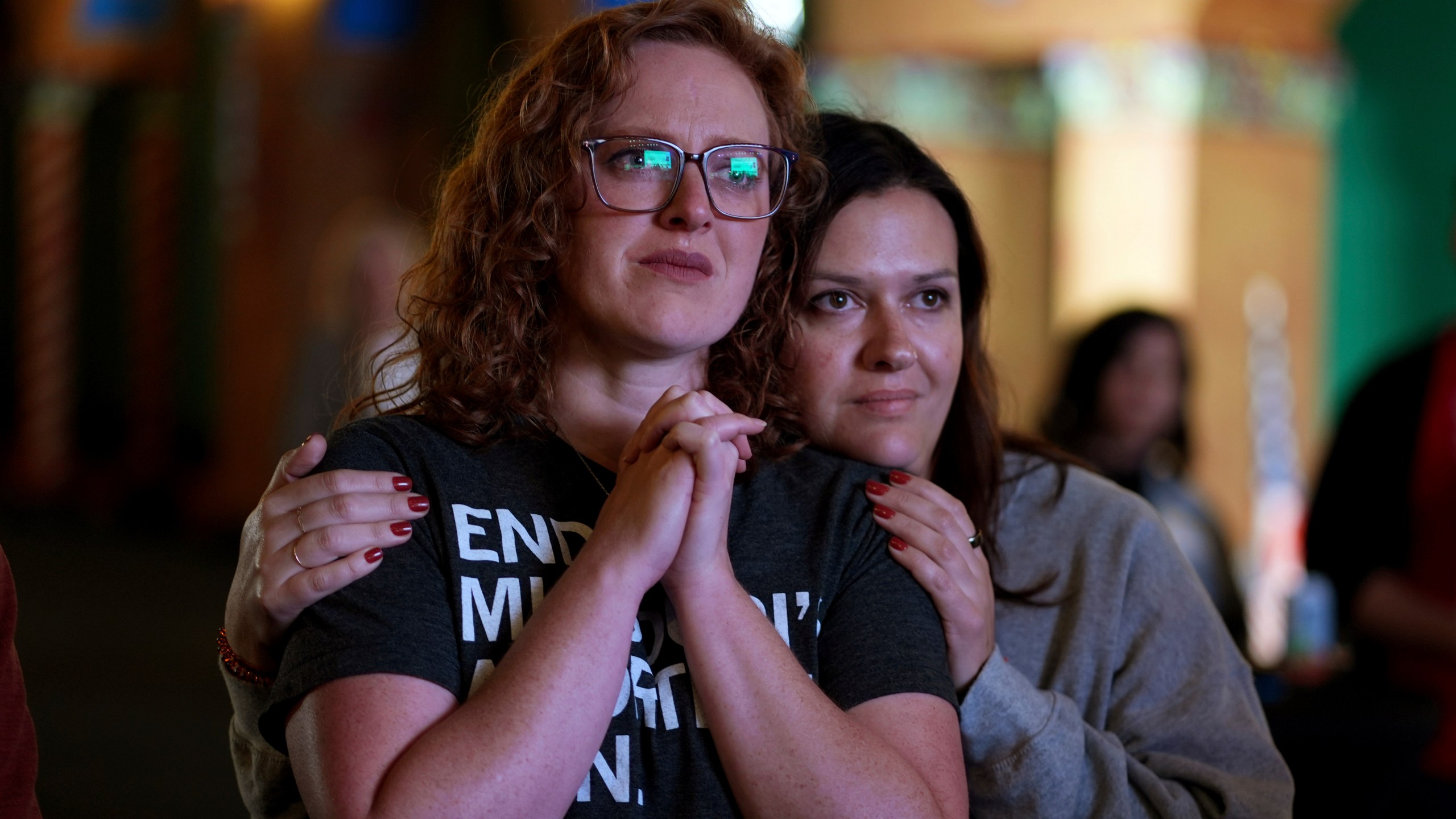 People giving there first names Erika, left, and Leeann react after an abortion rights amendment to the Missouri constitution passed, Tuesday, Nov. 5, 2024, at a watch party in Kansas City, Mo. (AP Photo/Charlie Riedel)