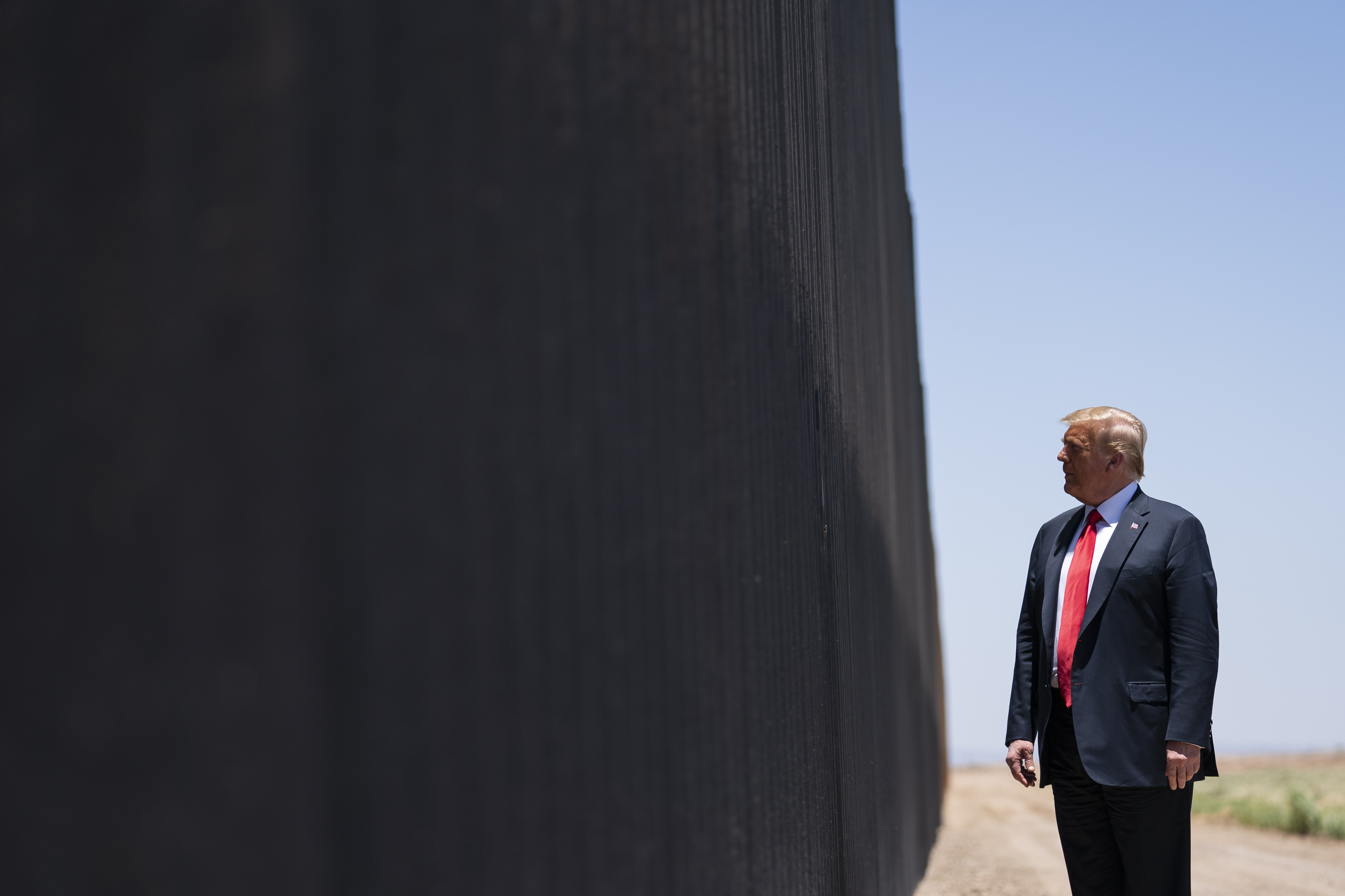 FILE - In this June 23, 2020, file photo, President Donald Trump tours a section of the border wall in San Luis, Ariz. (AP Photo/Evan Vucci, File)