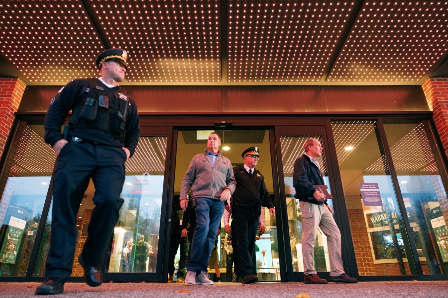 Police investigate the scene of a shooting at Navy Pier in Chicago, Tuesday, Nov. 5, 2024. Two men were shot and killed by a former disgruntled employee in one of the loading docks at Navy Pier. (Anthony Vazquez/Chicago Sun-Times via AP)